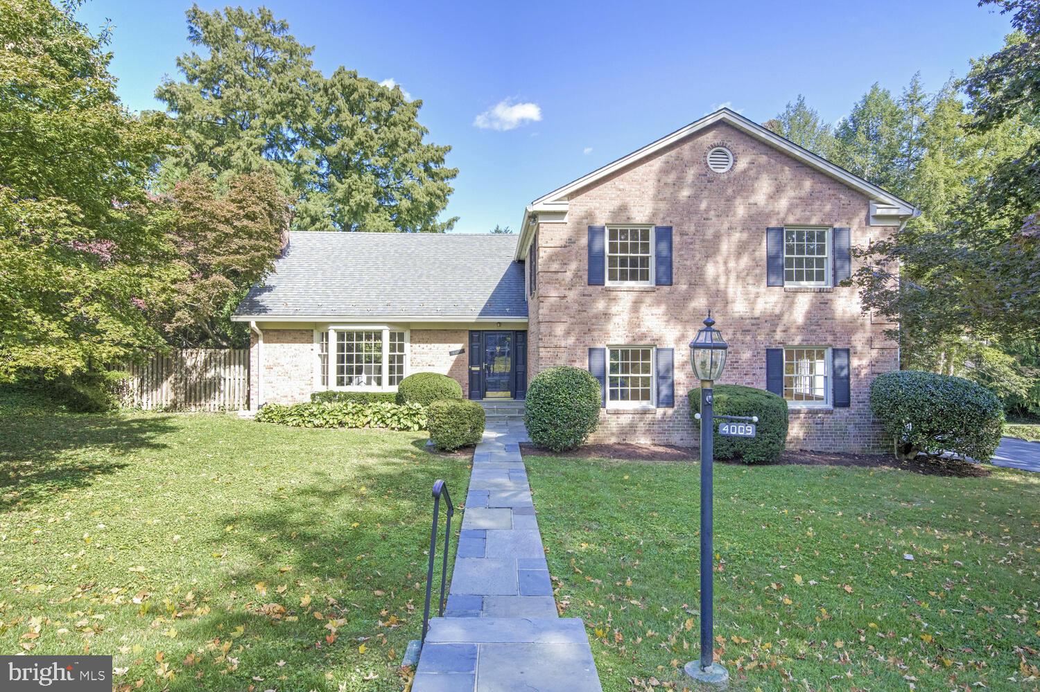 Located in the heart of the sought after neighborhood of Chevy Chase View, this home offers the new owner so many options for living, entertaining, recreation and working from home. The classic architectural profile belies the expansive interior rooms, which include a formal living room with a bay window, and a dining room that overlooks the gorgeous backyard and pool. A country kitchen with table space features a large window with serene views and leads to a hallway and substantial family room. This home style has been adapted by others in the neighborhood, who have taken the same original floor plan and removed the wall between the dining room and kitchen to create a chef’s dream, complete with a big island. Finished with a beamed ceiling, the family room offers a wall of floor to ceiling windows, access to the grounds, and a fireplace. Continuing down the hallway is a powder room and at the other side, a fabulous flexible space that is perfect for enjoying movies, games, a playroom or a home gym. This room can be accessed from the driveway, making it ideal for a professional office.
The upper levels offer 5 bedrooms all with ample closet space, 2 full baths, and an oversize walk-in linen closet. One room is enhanced with floor-to-ceiling bookcases, making it the ideal separate home office. A dormer-style attic-level bedroom with 2 closets offers abundant charm. There is a primary bedroom ensuite space consisting of 3 adjoining but separate rooms, making it the perfect owner’s suite with a large bedroom, a sitting room/study and a walk-in closet. This space also lends itself to a future renovation that would create a fabulous luxury bath.
The lower-level walks out and includes a large recreation room/laundry room, full bath, a big storage space, a cedar closet and yet another room that can be used for what your needs are. This level is perfect for a home fitness space and in summer can be used as the pool bath and wet towel drop.
Enhanced with a custom pool, a gazebo with a ceiling fan, a patio and a surround of lush gardens and trees, the backyard is truly your own private oasis. Summer memories to last a lifetime are created here. Just in time for cooler autumn evenings, add a firepit and enjoy the outdoor space even longer! For the buyer seeking their forever home with all the flexible living space for a lifetime, this is the one!
