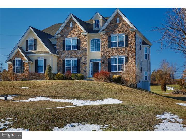 An escape from the ordinary, this home is designed to delight! Beautiful stone and stucco exterior that really is stunning, walk into the expansive foyer with gorgeous hardwood, this model showcases a side turned staircase with a dramatic bay window. Large eat in kitchen, beautiful extra high cabinets, granite counter tops, neutral tile floor, recessed lighting, all black appliances, gas range including built in microwave. Breakfast area has sliding glass door to deck and a half wall to family room that really opens up the home and makes entertaining a joy. Butler pantry has granite counter, wet bar, wine rack and extra cabinets. Dining room has gorgeous hardwood, tray ceiling, huge window. Family room is light and bright with a cozy gas fireplace and beautiful wood mantel that says welcome home. Formal living room that is bright and cheery. Playroom/office could have so many uses, playroom is great to keep the rest of the house neat and clean, office for the busy executive or a bedroom if you need a 5th room. Escape to your retreat in the huge master bedroom with a sitting room, walk in closet that will amaze you, sizable luxurious master bath with whirlpool bath, matching separate sinks and stall shower. 2nd bedroom can make a great guest bedroom with private bath. 3rd bedroom has a private entrance to hall bath. 4th bedroom, all bedrooms are very roomy. Laundry room is upstairs and is roomy enough to be a delight also has utility sink. Basement is the full foot print of the home, clean, dry although it is unfinished it is set up nicely to finish with 9' ceiling, and walk out, easy to envision as the owner set up with carpet, pool table and gaming, all utilities are located on far end of basement to make it easy to finish. 2 car garage and plenty of parking. 1.16 acres with above ground pool. Wonderful deck to grill and entertain. Great views. This picturesque home has it all, the convenience and beauty of newer construction, the country setting and no HOA fees. It's time to live the life you always wanted.