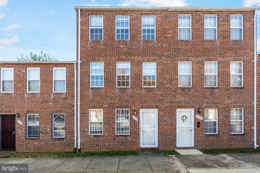 Welcome to this renovated all brick 4 Bedroom 2 Bath townhome. You will love the open floor plan with its new flooring and fresh interior paint, formal living room, nice sized eat-in kitchen, spacious bedroom sizes,  and adorable fenced patio. Home is close to everything, including shopping, highways, and Downtown and walking distance to Johns Hopkins hospital.  This is a must see!