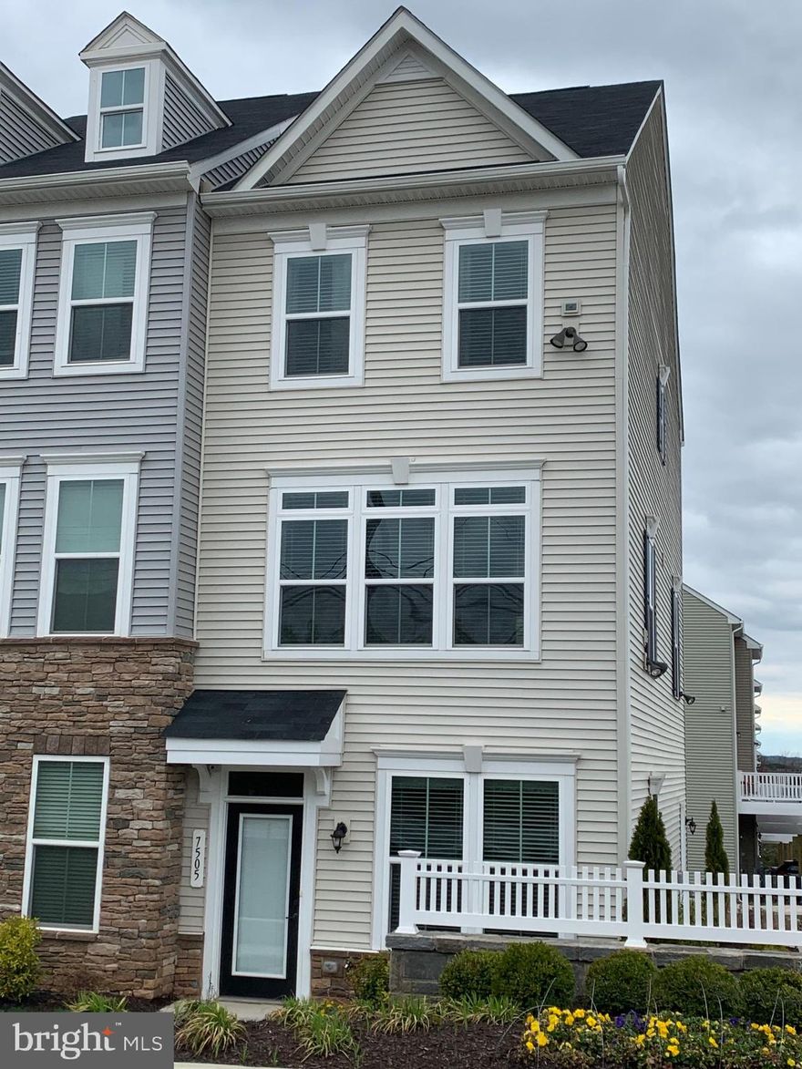 Landlord wants a minimum of 18 month lease.   Former builders MODEL Town house.  Immaculate 3 level end unit Town House with porch and gable at the front elevation of the TH.   Entrance level has a third bedroom and a full bathroom.  2 Bedrooms with attached bathrooms on upper level.  Spacious 1 Car garage with driveway and ample parking spaces around the Town House.   Much sought after area in Hanover and close to Arundel Mill Mall, Casino Live and and to many commercial and retail businesses.  This Town house was the builders former MODEL.  Fully loaded and in move-in condition.  Open floor planning with Living room, Dining room, Kitchen, Powder room and nice size deck on the main level.  Contemporary high end luxury laminate flooring in Living, Dining, all Bedrooms, Foyer and upper hallway.  LED Lights throughout.  Contemporary glass entrance door and stylish flooring at the entrance foyer.   Walls of windows on the front and back side of the TH and many windows on the side wall bringing in ample natural light.  Kitchen with contemporary 42" tall Maple Espresso Kitchen cabinets, center island and Stainless Steel appliances.  6' Wide glass sliding door from dining room leads to spacious low maintenance deck.  Large Master bedroom with lavish Master Bathroom, double vanity sink, shower with seat and walk-in  closet.  Second Bedroom has its own Full Bathroom.  Convenient located between Washington and Baltimore and close to BW International Airport.  Close to major roads such as Baltimore-Washington Parkway (I-295), I-95, Route 100, Route 1 etc.
House will be all cleaned, touch-up's done before the start of the lease.
AS THE TENANTS HAVE A BABY, PLEASE REMOVE SHOES WHILE TOURING THE HOUSE.