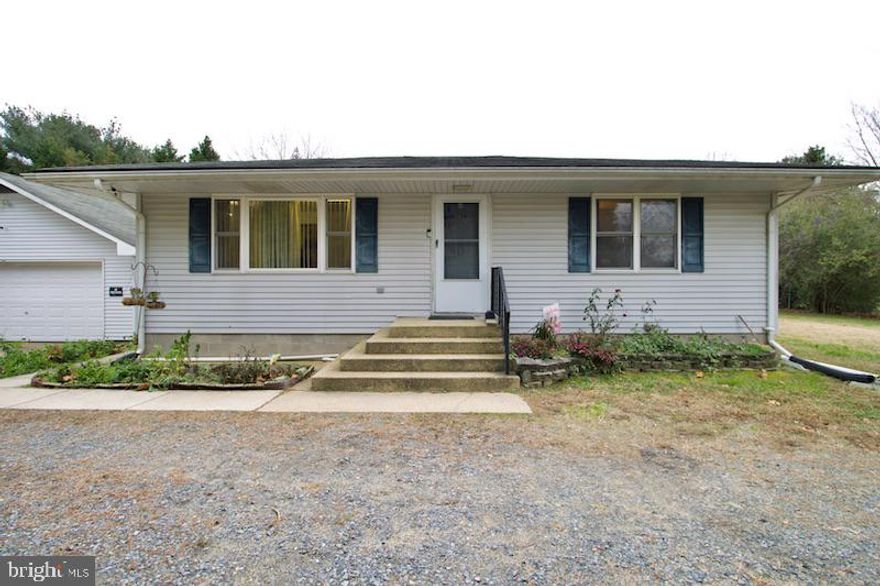 WOW!!!! ALL OF THIS  SITTING ON  a .68 ACRE LOT IN THE RURAL AREA OF MAGNOLIA.  This cute and cozy  little rancher with 2 large detached garages has tons of potential! This cozy little rancher offers 3 bedrooms 1.5 baths, a fully equipped kitchen with a full basement that has an emergency exit.  The home sits back off of the road behind a row of privacy trees.  The detached garages are great for storage or whatever your heart desires. The home is serviced by electric baseboard heat, window air condition units, a private well (no water bill) and it is connected to the public sewer line. Schedule your appointment soon and let your imagination take over! The home is being offered in "as is" condition. The Seller will not be making any repairs to the property.