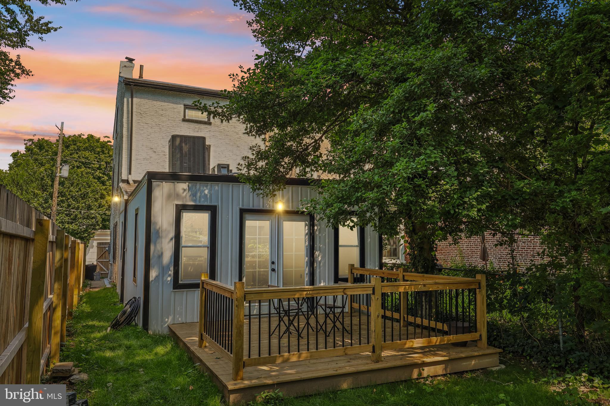 Welcome to 758 Carpenter Lane—a beautifully renovated home in the heart of Mt. Airy Village, just steps from Carpenter Woods and beloved neighborhood favorites like High Point Café, Weavers Way Co-op, and The Nesting House. Located in the sought-after CW Henry School catchment, this 3-bedroom, 2-bath home blends modern comfort with timeless character. Nearly every inch has been thoughtfully upgraded, including a brand new main roof and extension, new windows, insulation, drywall, plumbing, and new electrical panel. The stunning kitchen features new cabinets, all-new appliances, and a classic porcelain farmhouse sink. French doors open to a newly added rear deck—ideal for entertaining or enjoying the tranquil backyard. A convenient first-floor laundry area adds to the ease of daily living. Inside, the first floor boasts gleaming new wood floors, recessed lighting with dimmers, and a staircase with sleek metal rails. On the second floor, the luxurious primary suite offers a freestanding soaking tub, walk-in shower with glass doors, double vanity, and two spacious closets. A second full bath with barn door and two versatile top-floor bedrooms provide ideal space for guests, home offices, or creative studios. Additional highlights include a new HVAC system across all three levels, a mini-split unit in the extension, new front stairs, and a freshly poured concrete basement floor. Curb appeal shines with a welcoming front porch, new fencing, fresh exterior paint, gutters, and black metal window capping. Don’t miss the opportunity to own this move-in-ready Mt. Airy gem, where thoughtful design meets a vibrant community.