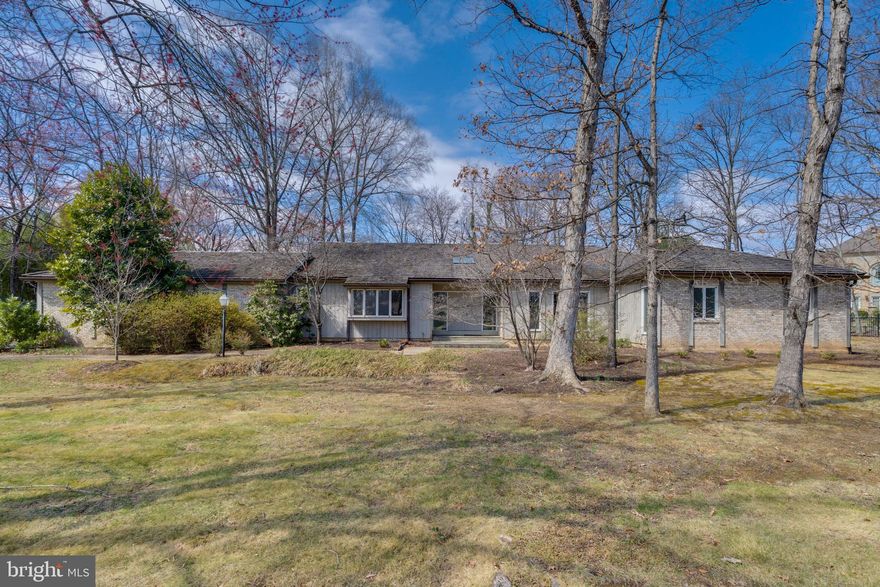 A true diamond in the rough, 10108 Ormond Road presents an extraordinary opportunity in the heart of Potomac Village, just a half-mile from the area's vibrant retail and dining center. Custom-designed and built in 1973, this timeless rambler-style home is being offered for sale for the very first time. Nestled on a picturesque 0.85-acre lot, the residence boasts over 3,600 square feet of main-level living space, with an equally expansive lower level, ready to be reimagined and personalized.

Designed to seamlessly integrate indoor and outdoor living, the home’s defining feature is a continuous wall of sliding glass doors that spans the entire back of the house— from kitchen through Great Room, den and primary suite. This integrative design ensures that nearly every space enjoys sweeping views of the expansive backyard, filling the home with natural light and a sense of openness.

A grand foyer welcomes you into the home flanked by a gracious formal dining room and an elegant formal living room. At the heart of the home, the Great Room impresses with vaulted ceilings, skylights, a fireplace, and seamless indoor-outdoor flow to an expansive patio, ideal for entertaining or quiet retreat. 

The renovated kitchen features solid wood cabinetry, granite countertops, gas cooking and a center island, all opening to a skylit breakfast room drenched in sunlight with private backyard views. 

The bedroom wing of the home offers exceptional space and versatility. A home office with a fireplace, adorned with a striking copper hood, serves as a quiet retreat with sliding doors to the patio and a private connecting doorway to the primary suite. The primary suite itself is large, offering the perfect footprint for a newly designed spa-like bath and an enviable walk-in closet. Down the hall, three additional generously sized bedrooms and two full baths provide comfort and flexibility. Rounding out the main level is a powder room, a spacious laundry/mudroom, and an oversized two-car garage, ensuring convenience and ease of living.

The lower level of the home is equally expansive, offering endless possibilities for recreation, work, or additional living space. A grand rec room, large enough to accommodate multipurpose areas, serves as the focal point of this level. Adjacent to it, a private den offers the potential to be transformed into a home gym or media room, while a separate bedroom suite with a full bath provides ideal accommodations for guests or extended family. Additional features include a cedar closet, multiple storage rooms, and a powder room for added convenience. The lower level can be accessed via two separate staircases from the main level as well as a walk-up exterior entrance, offering flexibility and privacy. 

With its unmatched location, expansive layout, and limitless potential, 10108 Ormond Road presents a rare opportunity to transform a custom-built Potomac Village estate into a modern masterpiece, just moments from shops, dining, and major commuter routes.