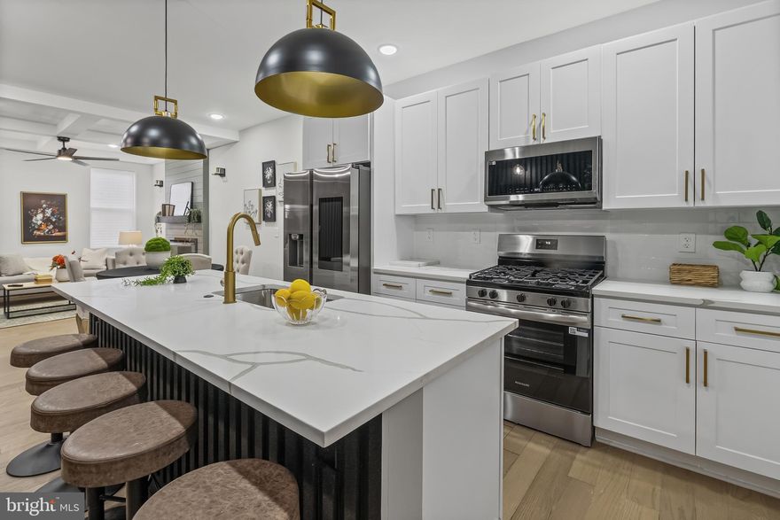 Sleek, stylish, and smartly designed—this porch-front modern home delivers three levels of luxury with 5 bedrooms and 4 baths, including a main-level suite that’s perfect for today’s lifestyle. Tech-forward buyers will love the smart home features, including a video doorbell, ceiling Bluetooth speakers with touchscreen controls, and backyard cameras—all designed to enhance comfort and security. The bold chef’s kitchen takes center stage with a Samsung Smart Refrigerator (21.5” touchscreen with apps), oversized quartz island, 5-burner range with microwave, designer backsplash, 42” soft-close cabinetry, and chic black-and-gold fixtures. A dramatic slat wall with sconces and custom wine display create striking visual impact.

Upstairs, the owner’s suite makes a statement with dual closets, an entertainment wall with fireplace, and a spa-inspired bath with double vanity and Multi person walk-in shower. Two additional bedrooms, a full bath, and 2nd floor laundry add convenience. The finished basement extends the living space with a family room for entertainment, dry bar, bedroom, full bath, and walk-out access to the fenced backyard.

From its crisp white-and-black brick exterior to the light-filled interiors with hardwood floors, and designer accents, this home exudes modern energy.  The home features a new roof, plumbing, HVAC, and 200-amp electrical service, fully permitted and inspected to meet modern standards and ensure worry-free living.

Conveniently located, this home is just 2 mile from Forest Park Golf Course, 3 miles from 3 separate major shopping malls in either direction with popular restaurants, 3 miles from the Baltimore Zoo and the expansive Druid Hill Park, 3 minute walk from Pimlico race Course where Preakness is held, 6 miles from Penn Train Station, and about 7 miles from the Baltimore Ravens & Orioles Stadiums. It’s also within walking distance ( 3 miles) Druid Hill Park, which offers numerous amenities, including playgrounds, tennis courts, ball fields, a frisbee golf course, a pool, basketball courts, greenhouses, picnic areas, the Howard Peter Rawlings Conservatory and Botanic Gardens, a Zen Garden, an urban greenway park, the Jones Falls Trail, City Farms Garden, Safety City, and the Lakeside Loop Trail around Druid Reservoir. The home provides easy access to major highways, I-695, I-70, I-83, and I-95. Seize the chance to call this striking residence your own, where modern luxury meets smart design. Schedule a showing today and experience the ultimate in contemporary living.