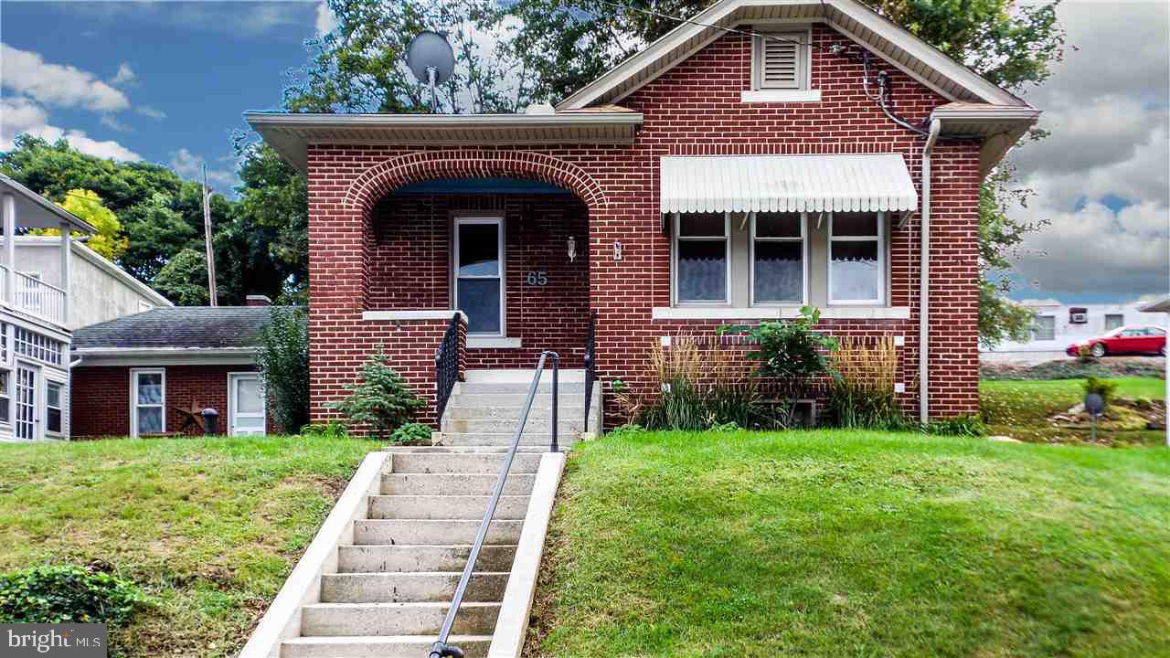 Solid brick ranch-super neat, clean & ready for you to move right in! Stylish! New Laminate flrs! New replacement vinyl windows! New kit w/tiled backsplash! New lighting! New tiled ba! New paint! A steal of a deal-thousands $ below assess! Covered front porch & rear brick priv patio! Incl appliances! (Appli sold ?as is?.) Great gas frplc in the LR too!