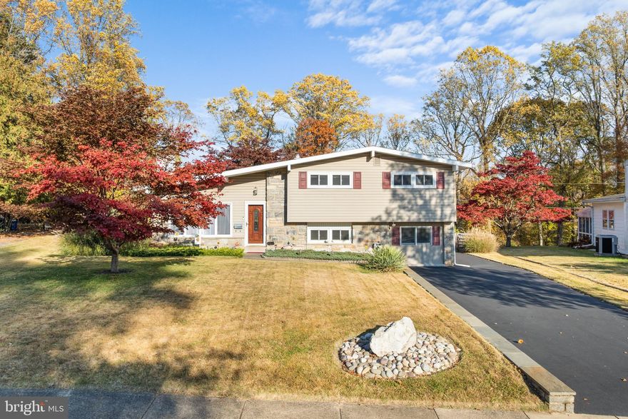 Welcome to your new home! Upon entering this sun filled contemporary split level home with vaulted ceilings, you will see it has been lovingly maintained. It has an open floor plan with wood burning fireplace in LR, DR and kitchen peninsula. Eat in kitchen boasts plenty of cherry cabinet space, granite countertops with stainless steel appliances. Large hall upstairs leads to 3 bedrooms; primary bedroom includes ensuite bath with whirlpool tub. Bright hall full bathroom features skylight. A bonus room for possible 4th bedroom, office or playroom with cedar closet is downstairs. Hardwood floors have been refinished, with hardwood under 2 upstairs bedroom carpets. Downstairs spacious family room, leads into a large laundry room, powder room, and small workshop with side door access to driveway. A large 3 season enclosed porch off DR looks out on private back yard retreat featuring an in-ground swimming pool with post and rail fenced perimeter and upper flat fenced area with built in natural gas grill.