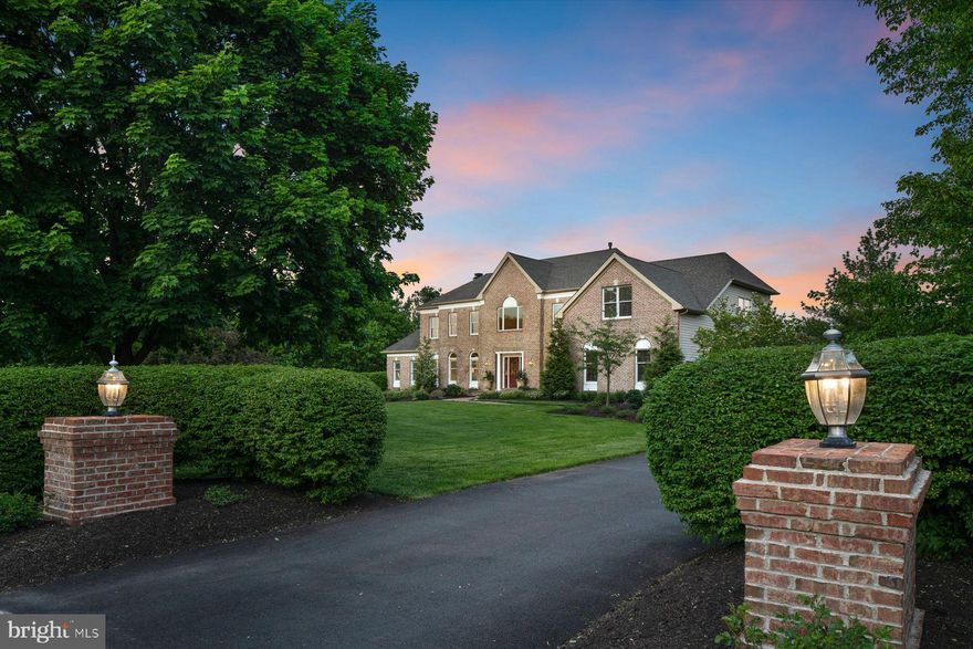 Stunning, turnkey home in a premier location in Upper Makefield Township. This lovely brick front colonial has been impeccably maintained and boasts many wonderful updates throughout. Nestled on 1.27 acres in a tranquil setting with incredible outdoor entertainment space that includes a saltwater pool with waterfall feature. The pool complex is surrounded by gorgeous, mature landscaping that provides ultimate privacy. The backyard oasis also includes a patio area with a stone fireplace, play area, outdoor kitchen with grill and covered trex deck. Enter this light and airy home into a 2-story foyer with updated hardwood floors throughout the main level. The foyer is flanked by a formal dining room and living room with a lovely study. The gourmet kitchen was designed by Noah and Lilly and completed in 2021. The kitchen features spacious island with pendant lighting, quartz countertops, Terra Bella marble tile backsplash, Mauser cabinetry, top-of-the-line stainless steel appliances, including a Thermador 6-burner dual fuel gas range with griddle, steam oven, custom range hood and a built-in Thermador coffee machine. Enjoy your morning cup of coffee from the breakfast room or under the mahogany ceiling of the covered deck with wonderful views of the backyard. A sleek barn slider door provides access to a walk-in pantry with custom built-ins. The open floor plan flows into the spacious family room with a stone, 2-way gas fireplace that is shared with a spacious conservatory room with vaulted ceiling and a wet bar. The main level also includes a powder room, a spacious laundry room and a drop zone area between the laundry room and the 3-car garage with Level 2 electric car-charging station to accommodate 2 cars. Head to the upper level of the home from one of two staircases and enter the spacious primary bedroom suite with a well-appointed sitting area. The primary bathroom includes two vanities, a corner soaking tub, tiled shower and a private water closet. The walk-in closet is outfitted with custom built-ins. There are 3 secondary bedrooms on the upper level. Bedroom 2 is en suite with a walk-in closet. Bedroom 3 is an expansive space with a sitting room and a large walk-in closet with custom built-ins. Bedrooms 3 and 4 share a Jack and Jill bathroom with double vanity. A completely renovated lower level offers an additional 1,600SF of living space to suit various needs, such as in-law/au pair or guest quarters or recreational space. Currently configured with an open floor plan that is comprised of a living room and dining area, a beautiful kitchenette, 2 flex/bedroom spaces, a full bathroom with walk-in shower, laundry room and storage. There is a chairlift from the main floor to the lower level and walk-out access to the back patio. Perfect for multi-generational living or guests. Additional updates and features: Hardwired Security System 2022, Lawn Irrigation, New Landscaping and Outdoor Lighting 2020/2021, New HVAC (3 Zones) 2021 & 2023, New Water Heater 2021, New Driveway 2022, New Roof 2017, Whole House Water Filtration System 2017, Updated Outdoor Kitchen 2023, Pool Renovation 2023, Custom Pool Cover 2023, New Pool Filter & Pump 2019, New Pool Heater 2018, Whole House Generator 2023. Incredible location! Walking distance to Jericho National Golf Club. Enjoy dining at nearby Bowman's Tavern & Washington Crossing Inn. Nearby charming towns of New Hope, Lambertville & Newtown. Enjoy local theater companies, galleries, boutiques, antique stores, museums, restaurants, golf courses and parks, such as Washington Crossing State Park, Bowman's Hill Tower & Wildflower Preserve and Tyler State Park. Enjoy walks along the canal path and river life. Plenty of space to work from home and conveniently located for your commuting needs. Accessible to 95 and NJ Train line to NYC. Commutable to Princeton and Philadelphia. Easy to drive to beach towns and the Poconos. Award-winning Council Rock School District and Sol Feinstone Elementary.
