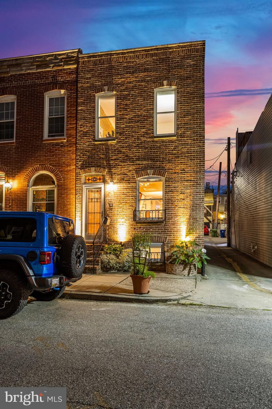 Welcome to 1430 Covington Street, a stunning four-level property located in the charming Riverside neighborhood! This home greets you with an open floor plan on the first level, boasting abundant natural light and gorgeous European beechwood hardwood floors. The expansive kitchen is a chef's dream, featuring custom cabinetry, granite countertops, and stainless steel appliances. The centerpiece is an expansive island with seating for four, perfect for casual dining or entertaining. This level also includes a convenient powder room. The finished basement level provides additional living space, ideal for a family room or recreation area, along with a storage room for all your organizational needs. The second level is dedicated to comfort and luxury. It features a primary suite with ample space for a king-sized bed, a walk-in closet, and an en-suite bathroom equipped with a large walk-in shower. Additionally, this level has a spacious second bedroom, a full bathroom, and a convenient laundry area. The third level offers versatility as a large living space or an additional bedroom. It includes a wet bar and a half bathroom, making it perfect for entertaining guests. This level leads up to a rooftop deck that offers expansive views of the Baltimore skyline and Inner Harbor, providing a perfect backdrop for relaxation or social gatherings. Completing this exceptional home is a two-car parking pad, a south Baltimore luxury! Moreover, the property underwent a comprehensive energy audit in 2015, resulting in numerous improvements to enhance its energy efficiency. Don't miss the opportunity to own this beautifully designed and meticulously maintained home at 1430 Covington Street, where comfort, style, and efficiency meet in perfect harmony.