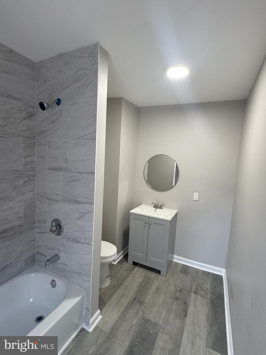 Large 4 bedroom 2 full bath twin. Home has recently been renovated with new vinyl flooring and modern grey paint scheme. Granite countertops with new kitchen cabinets. First floor full bathroom is especially convenient.