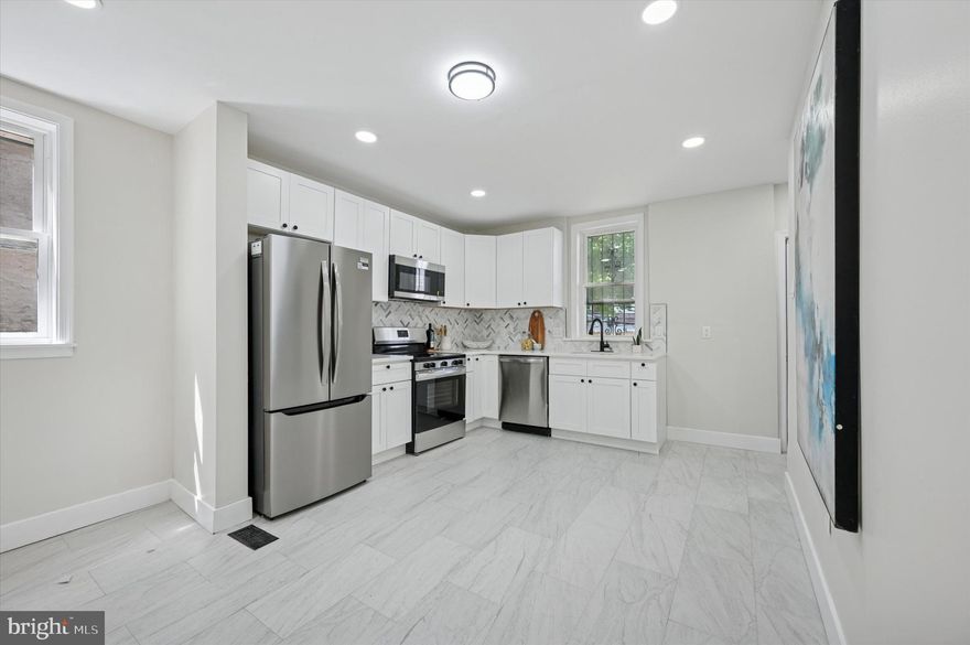 Welcome to 5013 Newhall Street, a beautifully renovated 6-bedroom, 2.5-bath home in the heart of Germantown. With over 2,500 square feet of living space across three spacious levels, this home offers the perfect blend of modern updates and timeless charm.

Step inside to find brand-new flooring, fresh paint, and a thoughtfully updated layout that flows naturally from room to room. The main level features a bright and open living and dining area, a sleek kitchen with stainless steel appliances, and a convenient half bath for guests.

Upstairs, you'll find generously sized bedrooms with ample closet space, along with two full bathrooms that have been fully updated with modern fixtures and tile work. Whether you're accommodating a large family or creating dedicated spaces for work and play, this home provides flexibility and room to grow.

Enjoy the outdoors with a rear deck and private yard, ideal for entertaining or relaxing. The in-law suite setup adds even more versatility, perfect for multi-generational living or potential rental income.

Located on a quiet residential block, you're just minutes from public transportation, La Salle University, local parks, and vibrant neighborhood shops and restaurants.

Move right in and enjoy the space, style, and comfort this turnkey home has to offer. Schedule your tour today.
