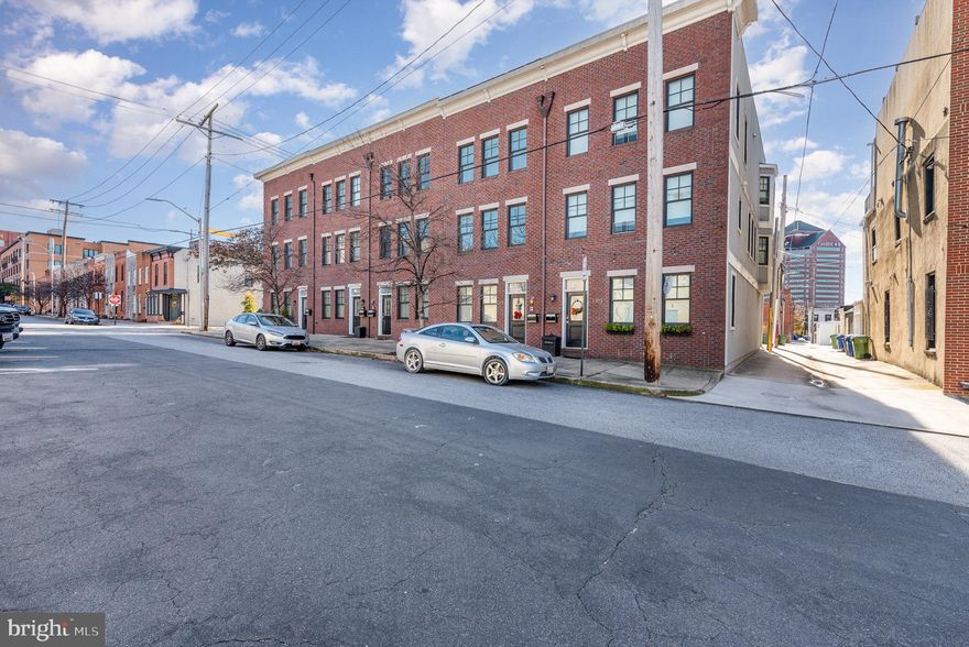 Step into this beautifully maintained Canton home, ready for you to make it your own! Start your day with a coffee on the rooftop deck, where you’ll enjoy sweeping views of the city skyline and water views—including Natty Boh and the charm of Canton.  Inside, the open layout features high ceilings, a family room with a gas fireplace, and a spacious kitchen with granite countertops, gas stove, generously-sized island, and a brand-new refrigerator. This level also includes a large breakfast area, powder room, and a balcony off the family room for easy outdoor access.  The upper level features two primary suites and two full baths. One suite offers an ensuite bathroom, a walk-in closet, and a private balcony with steps that lead up to the rooftop deck.  The entrance level includes an additional bedroom, full bath and laundry.  With a spacious garage offering ample room for parking and extra storage, plus a new roof added in spring 2024, this home has it all. Just a short stroll to Canton Square and Canton Crossing, enjoy the best of city living!