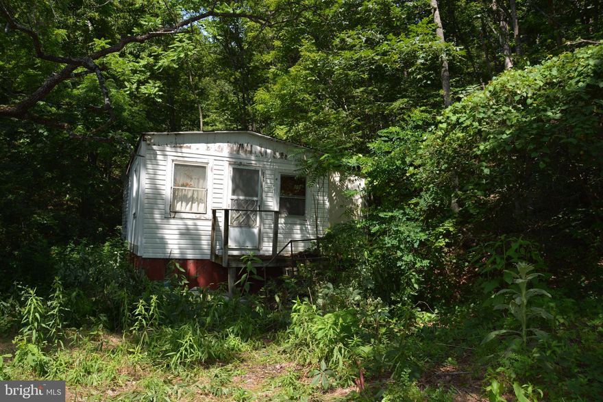 There are two lots here.  The front lot is 8.41 acres and has an old hunting cabin very close to the road. The cabin (camp) is in need of major repair or tear-down.  Electric was hooked up back in the day, but there are no sources for water (no indoor plumbing, no bath). The rear lot is 10.36 acres and and matches up borderwise with the front lot.  Access would be through the front lot. There are NO Covenants or Restrictions. NO HOA. Not within any subdivision.   There are ATV trails throughout the land and possibly some tree stands.  The land has mostly been used for hunting over the years and the trails are the passageways through the land (no vehicle paths).  Bring your hiking boots!  Let the listing agent know if you plan on bringing your ATV to explore.