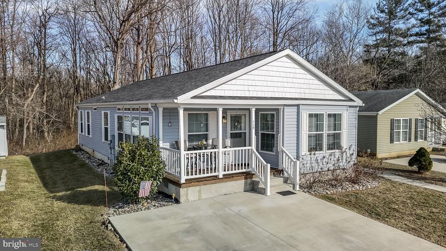 Welcome to 115 Curry Avenue in Cinnamon Woods, a 55+ Community in Conowingo, MD.  Located in Cecil County, Maryland there are many local opportunities for relaxation and recreation. This beautiful 3-bedroom, 2-bathroom manufactured homes features large windows allowing plenty of natural daylight, a spacious kitchen with an island, and ample counter and cabinet space.  Entering the home from a covered porch you will notice the open floor plan, perfect for entertaining between the eat-in kitchen and great room. The large primary bedroom features a bathroom ensuite and walk-in closet. The secondary bedrooms share a large hall bathroom.  The mudroom and laundry exit to a small deck overlooking the side yard. This home features an Amish built shed and additional storage in the crawl space. Ammenities include  a beautiful new community center, lawn care, snow removal, garbage removal, covered mailboxes, and onsite management. Be sure to put this home on your tour list and make this your next move. You will enjoy a serene lifestyle with easy access to travel, shopping, and restaurants.