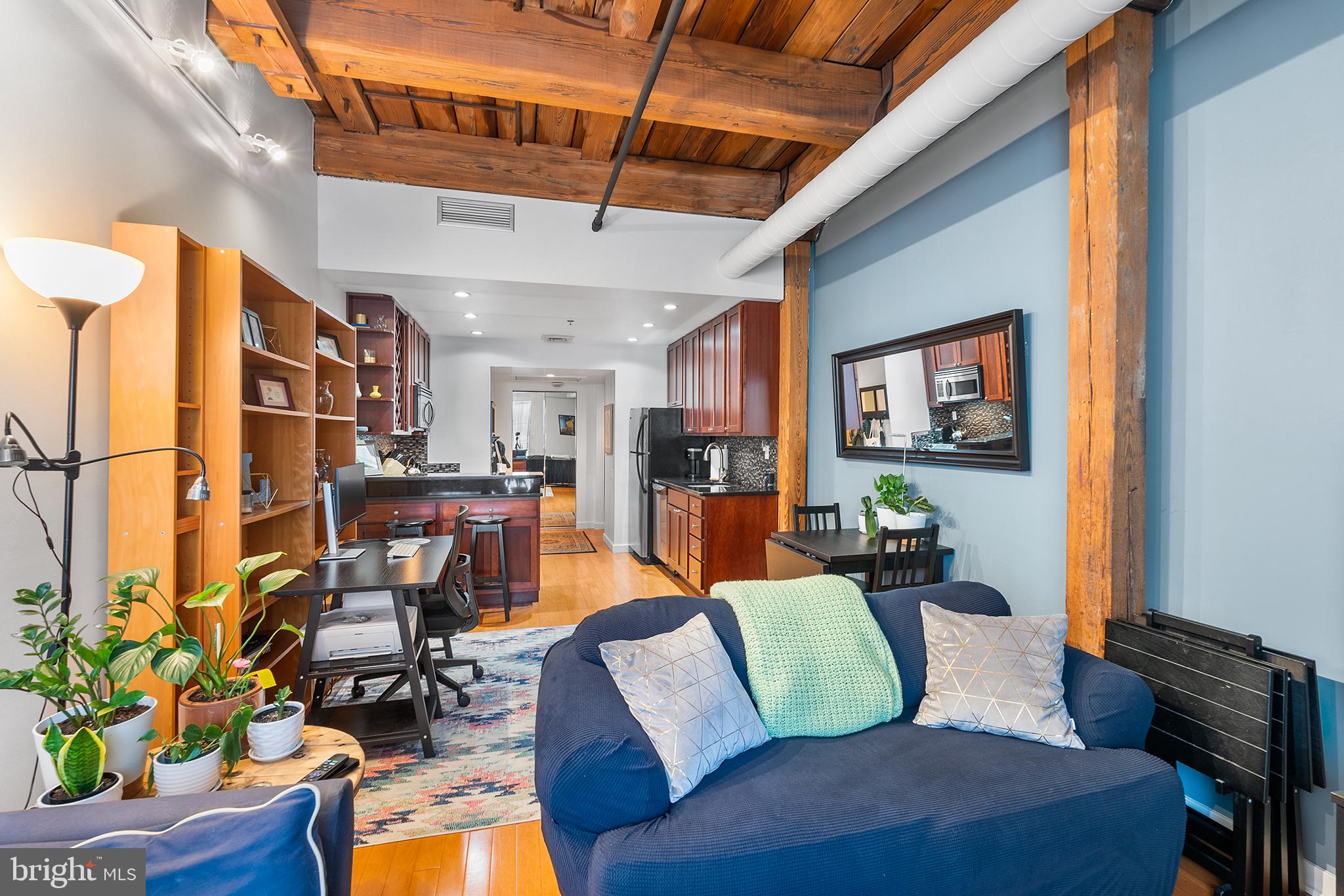 Searching for an elevated Old City condo that has already been tastefully remodeled, with pride of ownership, from top to bottom? Look no further! From the moment you enter, the quality and craftsmanship are apparent, with old and new design elements blended seamlessly together in a floorplan that takes advantage of every space. The kitchen features custom wood shaker cabinets, tasteful glass tile backsplash, built-in wine storage rack, stainless appliances, and stone countertops. Hardwood floors carry throughout the living areas. The contemporary loft design is reflected in the open beams and framing of this historic building. Light, bright bathroom with clean tile work. With laundry in-unit and ample storage throughout, this unit easily lives uncluttered and modern. Additional basement storage unit is included with the condo, as is access to bike storage. The HOA dues are particularly low, making this condo a striking value compared with many similar properties nearby. The location is second to none. Experience the vibrant pulse of Old City living with easy access to local dining, shopping, and cultural attractions. Every corner of this neighborhood tells a story, from cherished eateries like Cafe Ole, Kisso Sushi, and Race Street Cafe Cafe to historic landmarks like Independence Mall and The Liberty Bell. Convenient transportation options, including the Market Street line, make exploring the city a breeze. Whether you're strolling through Franklin Square Park or immersing yourself in the rich history of Elfreth's Alley, Old City offers endless possibilities for exploration and discovery. Step into the past while embracing the comforts of modern living at The Wireworks building, where historic allure meets contemporary convenience in the heart of Old City. FHA & VA financing accepted.