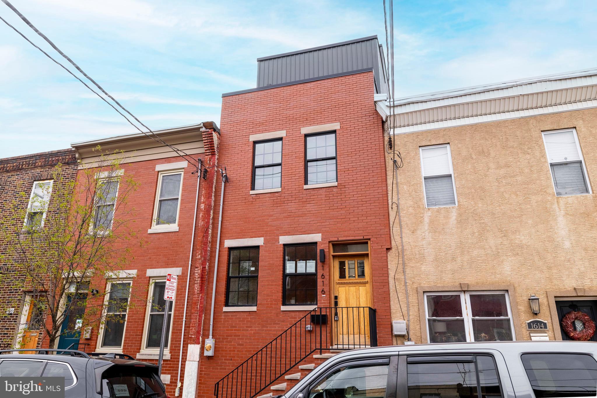Welcome to 1616 S 19th St, a stunning 2,600 sq. ft. custom-built home located in the heart of Point Breeze. This new construction offers unparalleled craftsmanship and luxurious living, with convenient access to Center City and Rittenhouse. Inside, you’ll find an open-concept living area featuring engineered hardwood floors and a gourmet kitchen with custom cabinetry, a spacious island, and stainless steel GE Café appliances. The backyard is perfect for entertaining, with a barbecue grill, artificial grass, and ample space for outdoor furniture.
On the second floor, there is a large guest bedroom with an en suite bathroom, a walk-in laundry room with overhead cabinetry, an additional hallway bathroom, and a spacious bedroom at the end of the hallway. The master suite boasts a deluxe bedroom, a walk-in closet with built-in shelving, and a spa-like bathroom with a double vanity, a large glass-enclosed shower, and a soaking tub. Off the master suite, you can enjoy your morning coffee on the front balcony.
The full-sized TPO rooftop deck offers breathtaking city skyline and panoramic views. The basement includes a full bathroom and space for an optional fourth bedroom or office. This property comes with a 10-year tax abatement and a one-year builder's warranty. Don’t miss this unique opportunity in the vibrant Point Breeze neighborhood. This property will hit the market on May 1st, 2025. Reach out for more information.