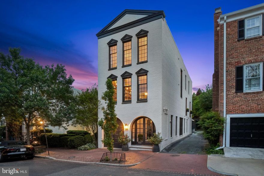 Located in the heart of Georgetown’s East Village, this exceptional residence seamlessly blends historic architectural charm with modern luxury: 4 bedrooms, 3 Full and 2 Half Bathrooms, with elevator to all floors, pool, and garage. Meticulously renovated under the direction of BarnesVanze Architects and Zantzinger, the home underwent a comprehensive, multi-phase transformation from 2017 to 2025. Every element—inside and out—has been carefully curated to deliver both refined elegance and functional convenience. All windows, doors, and skylights have been replaced or restored. Solid-core interior doors and refinished hardwood floors run throughout the home, while a private elevator services all four levels. Systems have been fully upgraded, including two new HVAC units with humidification and remote control, a whole-house water filtration system, five integrated cameras, ADT security, Sonos sound (indoors and out), and a 50-year roof installed in 2024. The heated one-car garage features built-in storage, automatic door, and water access.

The main level welcomes you with floor-to-ceiling windows and an open layout that includes a custom built-in dining banquette and a light-filled chef’s kitchen with Sub-Zero refrigeration, a Wolf six-burner range, double-motor hood, custom cabinetry, marble counters, and a large island. Triple French doors open to tiered gardens featuring a saltwater pool, self-filling fountain, new stonework, 3-zone Hunter irrigation system, integrated infrared heating, Sonos audio, curated plantings, and new fencing with dual gate access. Upstairs, the second floor offers a gracious living room with French doors opening onto a wide balcony overlooking the terrace and two Juliet balconies, a modernized fireplace, and a custom wet bar with soapstone counters, Sub-Zero fridge, icemaker, and hot/cold water. A stylish library with plantation shutters and a designer powder room complete the level. The third floor features a skylit primary suite with dual closets and a Waterworks spacious bath with soaking tub and marble-tiled shower. Two additional bedrooms, one king-sized, share a beautifully renovated full bath with an oversized walk-in shower. The lower level is fully renovated with waterproofing, Powder Room, a guest suite with walk-in closet, a new full bath, family/media room, utility room with washer/dryer, and custom wine storage. Truly a rare opportunity for refined city living, this move-in-ready home offers architectural integrity, thoughtful design, and total peace of mind.