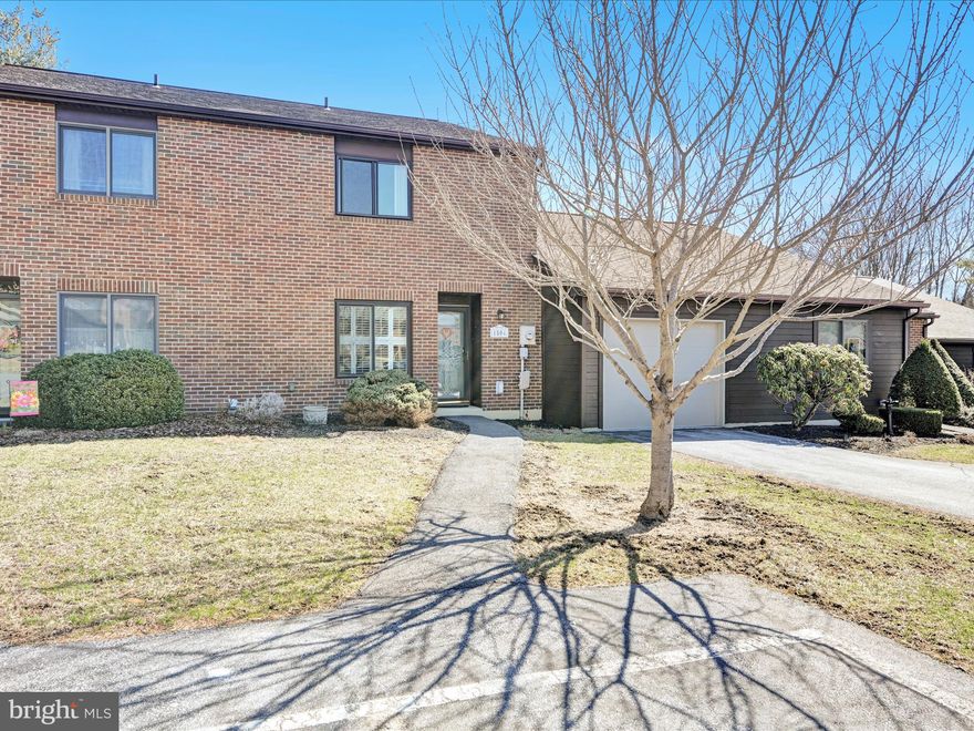 Experience a leisure lifestyle in this inviting 2-bedroom, 1.5-bath home.  The interior features hardwood, laminate and ceramic tile throughout, providing both style and durability. Kitchen has breakfast bar and includes all appliances. The living room features a brick fireplace, perfect for relaxation. with new sliders leading to a concrete patio, perfect for outdoor entertaining.  Additional storage is available with pull-down attic access.  Newer windows and doors.  The Pinebrook townhouse community has recreation facilities that include: community swimming pool, a tot lot/playground area, picnic pavilion, tennis courts and basketball court area. The HOA takes care of the exterior lawn maintenance and snow removal so you can spend less time working on your property and more time enjoying it. Don't miss this opportunity to live in the sought-after Pinebrook community!