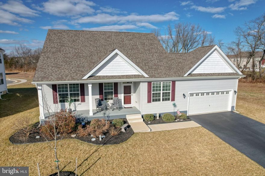 Welcome Home! This stunning property is just like new and ready for you to move right in. From the moment you step onto the inviting front porch and enter the foyer, you’ll feel the warmth and care that has gone into maintaining this immaculate home. Beautiful LVP flooring flows seamlessly from the foyer throughout the main living areas, creating a stylish and durable foundation for everyday living. The well-appointed kitchen is sure to impress, featuring crisp white cabinetry, gleaming granite countertops, and stainless steel appliances. The center island offers the perfect spot for casual meals or morning coffee, while the separate dining area provides ample space for gatherings and entertaining. 
Just off the kitchen, the comfortable living room offers an ideal place to unwind, with sliding glass doors leading to an expansive 16x18 low-maintenance deck overlooking open space — a perfect setting for relaxing evenings, weekend barbecues, or simply enjoying the view. The thoughtfully designed main level includes a spacious first-floor primary bedroom complete with an attached bath for added privacy and convenience. A second guest bedroom, full hall bath, and laundry room round out the main floor. Upstairs, you’ll find a versatile loft area that can easily serve as a home office, playroom, or additional living space. This level also features another full bath and an additional bedroom — perfect for guests or extended family. Need even more room? The full basement offers endless possibilities and includes a bar and workbench, making it ready for your finishing touches. This beautifully maintained, move-in-ready home truly has it all. Don’t miss your opportunity — schedule your showing today!