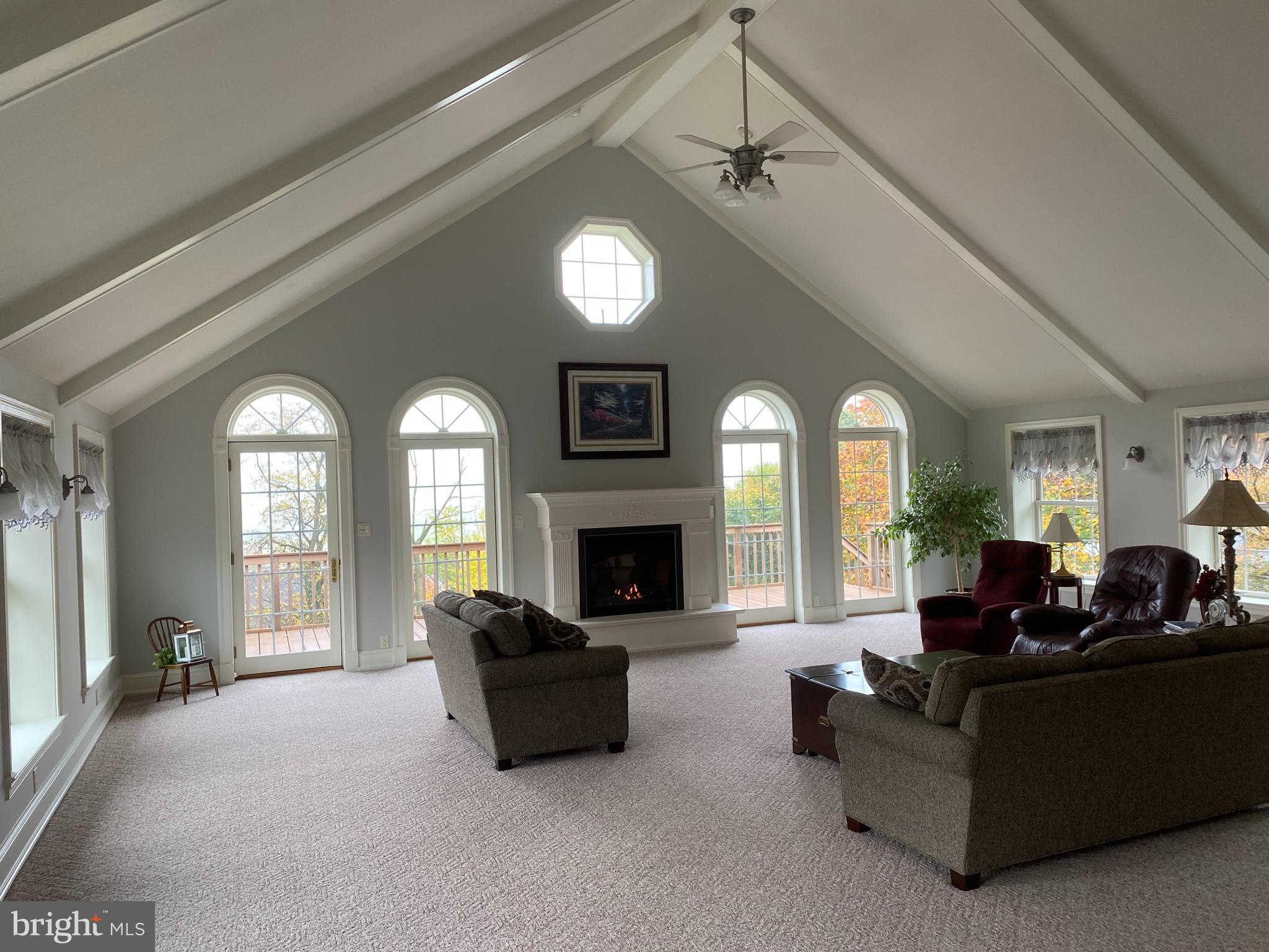 Beautiful 28 x 29 family room with gas fireplace and incredible view out across the countryside. Vaulted ceiling. Nice custom kitchen with Corian counter top. Owners' suite with whirlpool tub and shower. Nice spacious rear yard. Deck with outstanding views. 29 x 29 garage.