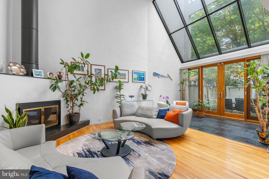 For the discerning buyer seeking a rare Society Hill residence with architectural pedigree, exceptional entertaining space, and luminous interiors, 639 Pine St delivers. This commanding 3-story corner home offers 4 bedrooms (one currently fitted as an office), 3.5 bathrooms, 1-car parking, a finished lower level, a private patio, and an expansive roof deck—moments from The McCall School.

A striking brick-and-stucco façade sets a refined tone. Inside, a proper foyer with coat closet and a discreet wet bar introduces elegant, thoughtfully scaled rooms. To one side, a formal dining room welcomes dinner parties with ease; the adjacent chef’s kitchen showcases custom Italian blue cabinetry, breakfast bar seating, and professional-grade appliances—plus direct driveway access for concierge-level convenience. Across the main level, the sunlit living salon impresses with soaring two-story volume, hardwood floors, a classic fireplace mantel, and a dramatic solarium framed by sloped glass with doors to the patio.

The finished lower level extends everyday luxury with flexible lounge space, a powder room, a large laundry room, and generous storage. Upstairs, the second-floor primary suite is a private retreat with tall windows, bespoke built-ins, a boutique-style walk-in closet, a standalone vanity, and a sleek bath with glass-enclosed shower. An airy loft—open to the living room below—creates a perfect reading or lounge perch. The third level features a gracious secondary suite with its own bath, two additional bedrooms (one elegantly outfitted as a custom office), and a full hall bath.

Crowning it all, the expansive roof deck sets the stage for open-sky entertaining all season long. Comforts include multi-zone heating and cooling, gas heat, and gas hot water. With a 97 Walk Score, you’re surrounded by celebrated dining, charming boutiques, parks, and neighborhood amenities—Washington Square and South Street are close by, while Jefferson and Penn are within an easy stroll. Seamless access to public transit, I-95, and South Jersey completes the picture.

A polished Society Hill sanctuary—schedule your private tour today.