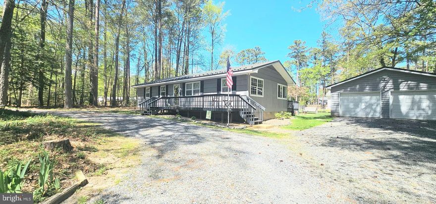 Welcome to this charming home nestled on a peaceful street in the heart of Lusby. This well-maintained property offers the perfect blend of comfort, functionality, and serene Southern Maryland living. Surrounded by mature trees and natural beauty, the home provides a sense of privacy while still being conveniently located near shopping, dining, and commuter routes.
Inside, you’ll find a thoughtfully designed layout featuring spacious living areas filled with natural light, creating a warm and inviting atmosphere. The home offers comfortable bedrooms and practical living spaces ideal for both everyday living and entertaining. Whether you're relaxing indoors or enjoying the outdoor setting, this property delivers a true sense of home. 
Step outside to appreciate the generous yard space—perfect for gatherings, gardening, or simply unwinding in a quiet setting. Also offering a oversized detached 2 car garage perfect for housing vehicles, storage or a car lover!  Located within a community known for its access to parks, waterfront areas, and recreational opportunities, this home is ideal for those seeking both tranquility and convenience.
Don’t miss the opportunity to own a piece of Lusby living—where comfort meets charm in a beautiful natural setting.