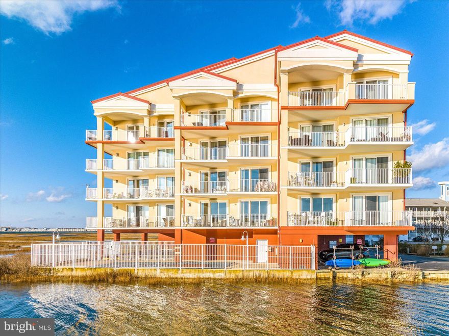Welcome to Thee Christina C! Enjoy everything Ocean City has to offer in this private, waterfront building located only a few blocks from the beach with direct views of the bay, wetlands and wildlife. This three bedroom end unit, formerly the model for the building, offers 9 ft ceilings and a ton of natural light from the floor to ceiling windows that lead out to the large balcony, perfect for relaxation and taking in the views of the private cove and spectacular sunsets over the bay. Enter to find a large open concept living, dining and kitchen area. Prepare gourmet meals in the spacious kitchen, with dual oven and induction range, or go down to the community grill deck on the private pond. The master suite is furnished with a new, adjustable king bed, complete with a walk-in closet and master bath containing a huge shower, jacuzzi tub and dual vanity. With two additional bedrooms and another full bath, there is plenty of room for all to enjoy. The sparkling pool on the property is perfect for hot summer days and a cozy fireplace inside will keep you warm on chilly fall and winter evenings. A large laundry room and pantry closet provide convenience and additional storage. There is a kayak rack and separate ground level storage unit for all your toys to make trips to the beach or out on the water easier. Thee Christina C is an extremely well-maintained building with healthy reserves, covered parking, elevator access and a secure lobby that does not allow short-term rentals. Peace of mind and the tranquility of the property makes this the perfect place to call home! This unit is being offered fully furnished as shown – ready for you to move in today! Come see it in person before it’s gone!
