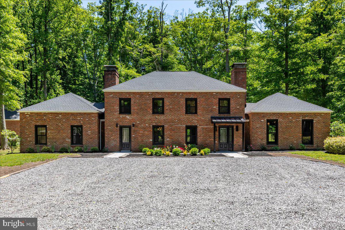 Situated on nearly 4.5 acres and backing onto Carson Woods, this thoughtfully renovated and updated, this classic style home has been stylishly updated, yet allows many of the original features sparkle throughout the home. Arriving at the home, a sense of calm and serenity is immediate as you soak up the location, lush greenery, mature trees and privacy, a place to relax and recharge. Upon entering the property, the feeling continues. The living room, with its paneled walls and built in book cases, hints to perhaps a storied past. The fireplace adds to the glamour of the space and the high ceilings add drama. Leading from the living room we enter the heart of the home with the kitchen/ family room combo. The Large decorative fireplace is truly the center piece of this space. The kitchen is completely new with white cabinetry and granite counters. The island has a waterfall style counter in quartzite. All appliances are the Italian brand Bertazzoni, known for its style and quality. Beyond the family room is the mudroom and utility room – including a half bath and then in its own separate wing a bedroom with private bath. The bedroom has a walk-in closet and yet another fire place for a hint of romance. The bathroom has a soaking tub as well as a separate shower stall and vanity. The large primary bedroom is a good size and even has a spot for a sitting area. The large ensuite bath has the second soaking tub in the home, an oversized shower and double vanity. The second bedroom has the original Parkay flooring from the home and has been refinished. There is a walk-in closet here too. The hall bath which services this bedroom has a shower and vanity. Just a few steps away from the main house is the one bedroom cottage/ guest house which has one bedroom and is fully self-contained and tastefully updated with 2 fireplaces, one being decorative. There is a 2 car detached garage too! Enjoy this oasis just minutes from downtown Princeton and everything it has to offer!