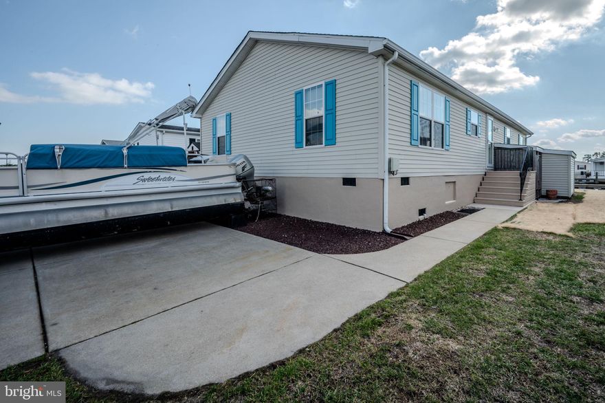 FOR SALE- An incredibly well taken care of, updated home in Mariners Cove.  Just across Long Neck road and Paradise Grill in Millsboro.  Drive the golf cart right over to Paradise Grill and enjoy everything that this upcoming retreat location has to offer.  Recent updates include-New Bulkhead Summer 2024, New Large Rear Deck 2025, Back/Side Yard Regraded and Stoned 2025, Enclosed Outdoor Shower, Base of Home Reparged & Painted 2025, New Window Screens 2025, Upgraded 20ml Flooring 2022, Larson Storm Doors 2025, New base molding/trim throughout 2025, New wood burning FP 2024, 5 ceiling fans, New Water Heater with Upgraded Expansion valve 2025, New Fridge/dishwasher/washer/dryer 2022 or newer.  This is exactly the type of Seller/Owner that a Buyer hopes to find.  You will see the care they have taken right away, and fall in love with this house.  Mariner's Cove Community has a large Club house, Community Pool, Fitness Center, Covered Picnic Area, and Marina for use by all homeowners.  Do not drag your feet on this one, CALL the listing agent DIRECTLY - Phone number listed below.