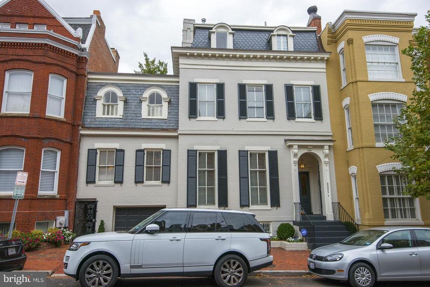 Grand 5 BR, 5.5 bath home perfect for entertaining with voluminous ceilings, 6 fireplaces, spacious brick patio and attached garage. LL with lots of potential. Spacious master suite with extensive closets, two master baths and an attached master sitting room. Over 5,000 sq ft above grade living space.