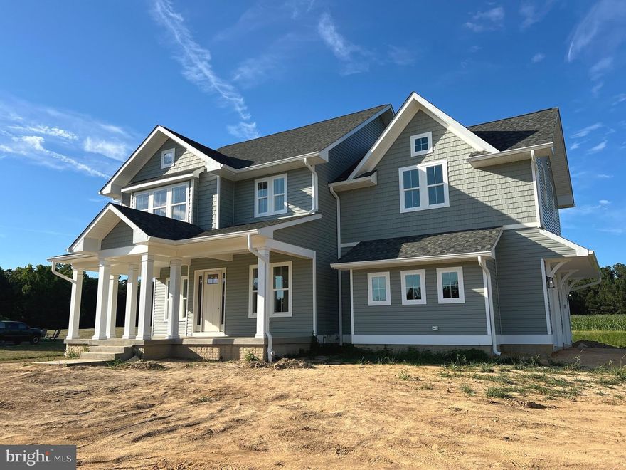 Gorgeous custom home located in Sunset Ridge features an open craftsman floor plan. Key Features: Ceilings: 10' on the main level, 9' on the second level,  5 bedrooms, 4.5 bathrooms.  Gas Appliances: Range, fireplace, and tankless water heater provided by Taylor Gas. Interior Doors: Solid core. Exterior Doors: 8' on main level, 8'x12' rear slider off living room. Kitchen: Thor appliance package, quartz countertops, 40 sq ft island, butler's pantry with wine cooler, kitchen desk, and pot filler above range. Siding: Premium Certainteed Monogram with staggered shaker accents. Drainage: Interior and exterior drain systems; basement floor drain linked to sump pump. Master Shower: Oversized with dual shower heads.
Upstairs Laundry: 60+ sq ft.  Flooring: Luxury Vinyl Plank (LVP) throughout main and second level, carpet in basement, tile in all bathrooms and laundry. Mudroom: Cubbies (3). Master Bath: Standalone tub. 
Basement: Wet bar hookup. Gutters: 6". Wiring: CAT 6A. Pantry: Trimmed 40 sq ft. Closets: Custom trim, accent wall in dining room. Heating: Electric, dual systems. Hardware/Fixtures: Black hardware and Moen plumbing fixtures. Hose Bibbs: 3 exterior. Roof Shingles: Tamko Titan XT, voted 2024 product of the year in the home protection category. Garage: 100% fire code 5/8 drywall, two oversized 9x8 garage doors, pedestrian door, work/storage area. Bathrooms: 100% mold-resistant drywall. 
Specifications: Square Footage: First Floor: 1,487 sq ft, 
Second Floor: 2,049 sq ft, 
Basement: 1,089 sq ft finished, 1,423 sq ft total (mechanical room unfinished), 
Entry Porch: 377 sq ft, 
Rear Porch: 233 sq ft, 
Garage: 642 sq ft, 
Under Roof Total: 6,211 sq ft. 

This custom home combines luxurious features with practical amenities, making it an ideal choice for discerning homeowners. From high ceilings and premium materials to advanced systems and thoughtful design details, every aspect of this home has been carefully considered for comfort, functionality, and style. 
Ready for occupancy within 30 days.