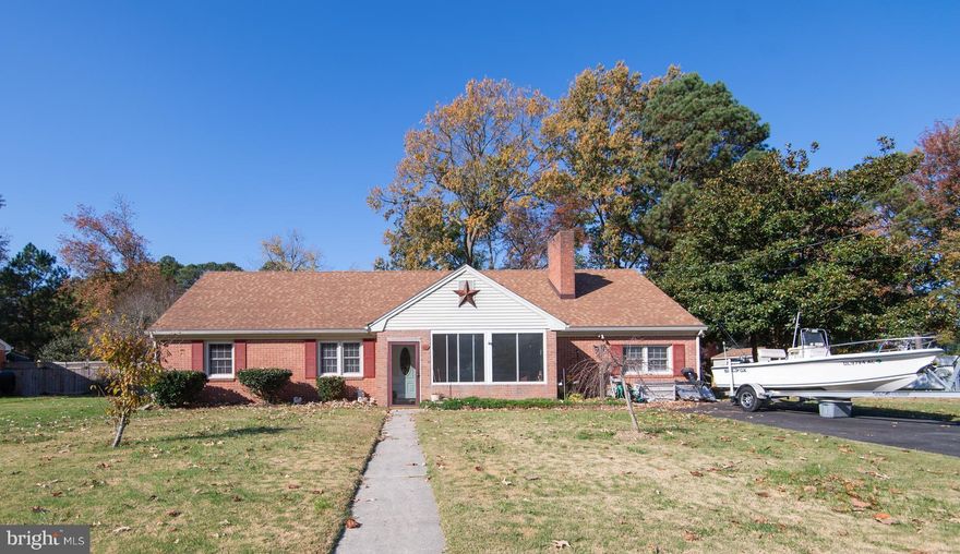 GREAT HOUSE & GREAT LOCATION  This well-maintained brick home is nestled towards the end of a non-thru street so quiet time can be enjoyed while relaxing on either the front or rear enclosed porches.  Cozy up on those cool nights by the fireplace in the living room that is flanked by built-ins and an oversized mantle. An additional oven/stove (gas) is located in the Laundry Room to accommodate cooking for large family gatherings - or remove it for extra space. The family room offers plenty of extra living space, which could be converted back to a fun game/den.  Current owner installed Heat Pump/AC, Roof, laminate plank flooring, gutter guards, and additional appliances. Fully-fenced back yard.  No worries that come with having a crawl space as this house is on a slab foundation. Property being sold AS-IS, no known issues.