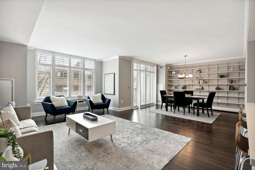 Outstanding 2 BR, 2.5BA six year young condominium at Hampden Row, awarded by Bethesda Magazine as the #1 Best New Luxury Condominium in 2017.  Almost too many features to describe.  After entering into a large foyer with a powder room off to the left, one is greeted with a spectacularly laid-out open floor plan which includes a very large living room, well-defined dining area and drop-dead kitchen with all the great stuff and a huge island with pull-up bar seating.  There is also in this area of the apartment a good-sized and very practical study and a south-facing balcony accessed through glass doors adjacent to the dining area.  One enters the bedroom area via an attractive hall which includes a laundry closet along with two huge hanging/storage closets.  The primary bedroom is lovely.   The private bathroom is even lovelier and includes double sinks/vanity cabinets, a soaking tub, large separate shower, and loads of storage.  There is not one, but two, impressive walk-in closets between the bedroom and the bathroom.  A second bedroom with ensuite bathroom finishes off this section of the apartment.  Wood floors and six foot high windows with handsome plantation shutters throughout the main rooms.  The spacious closets  are all customized.  24/7 front desk, fitness room, beautiful club room, roof deck - the amenities are outstanding.  And of course, the location: walk to dozens and dozens of restaurants and shoping options and Metro is close by.  This is a truly wonderful offering.  Open Sunday, January 21 from  1-3 pm.