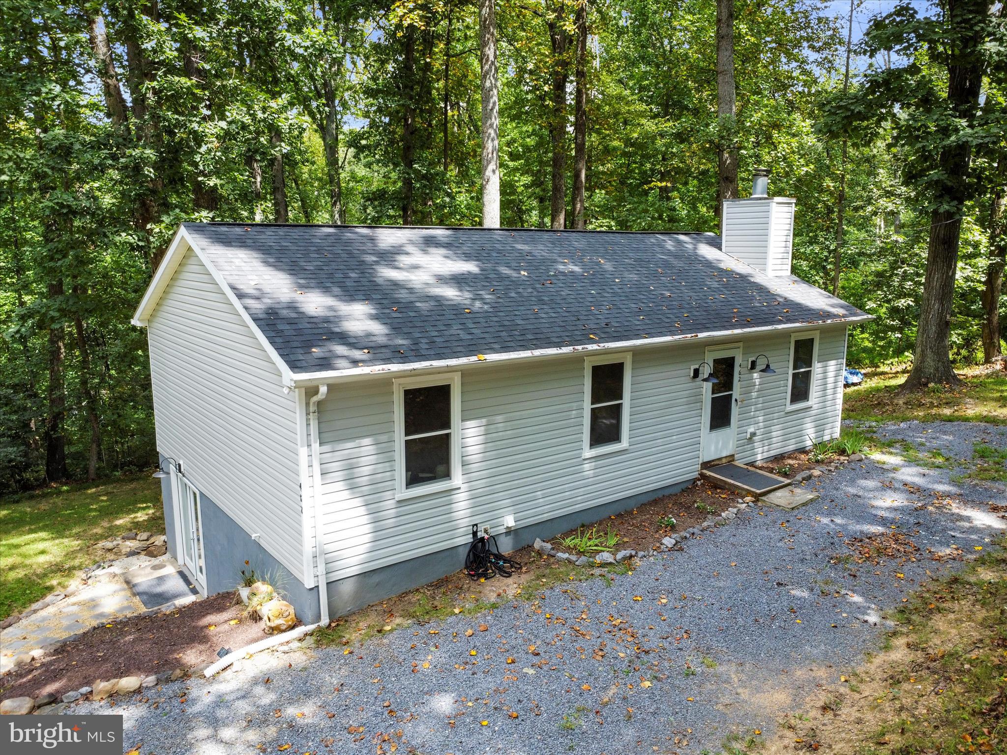 **PRICE IMPROVEMENT! Motivated sellers!** Updated rancher with finished basement on nearly a half acre lot with no HOA! Excellent location: the privacy of Shannondale without a long hike up a mountain, as this home is just 0.7 miles off Mission Road, on paved roads all the way. If you've been wanting to have a big garden or raise chickens, you can! Lots of peace and privacy, with mature trees all around. Lots of recent improvements so you won't have to! New windows (2024), new well pressure tank (2024), new roof (2023), new HVAC (2024), new water heater (2022), new flooring and paint (2024), new flagstone walkway to basement entry (2024), freshly professionally cleaned carpets (2025). With all these upgrades, this home is move in ready! Enjoy Lake Shannondale, a private 55-acre lake with a beach and the Lakeside Bar & Grill. Close to hiking on Appalachian Trail and all the history in Harpers Ferry. This is the peace and privacy you've been looking for!