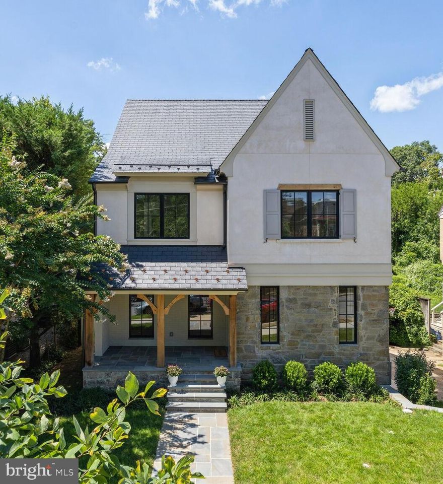 TOTALLY REBUILT LUXURY HOME WITH MAJOR EXPANSION THAT HAS IT ALL! Over 5,000SF in desirable Wesley Heights location! Designer finishes and expert craftmanship throughout with a modern floor plan that is perfect for today’s living. This turnkey, four level home features 6 Bedrooms, 6.5 Baths, outdoor space, two-car Garage, and additional off-street Parking. Sophisticated details throughout, such as white oak hardwood floors, stunning Visual Comfort light fixtures, and custom millwork, add warmth to the home. The center of the residence is the expansive Living Room focused around the wood burning fireplace with custom soapstone mantle, over 9’ ceilings, and access to the rear patio and yard. The gourmet Kitchen opens to the Living Room and features custom cabinets, marble countertops, center island, two sinks, custom-paneled SubZero refrigerator/freezer, Wolf six-burner gas range, two stainless steel dishwashers, and microwave drawer. The light-filled Breakfast Area includes additional custom cabinets with steam oven, adding both workspace and functional storage. The formal Dining Room is connected to the Kitchen via the Butler’s Pantry with sink, custom cabinets, marble countertops, and large panty closet. Completing the main level is the private Office with glass doors and an elegant Powder Room featuring Phillip Jeffries wallpaper. On the second level is the Primary Suite with vaulted ceiling and wood beam detail, two walk-in closets, and luxurious Primary Bath with heated marble floors, soaking tub, double vanity, sconce lighting, and glass enclosed shower. Three additional Bedrooms, all with en-suite Baths, and Laundry Room #1 are also found on the second level. The third level includes Bedroom #5 with en-suite Bath. The spacious lower level includes a Family Room, Bedroom #6, full Bath #6, Mud Room with bench and shiplap wall detail, Laundry #2, and access to the-two car Garage. Perfect for indoor/outdoor entertaining, the rear yard is accessed from the Living Room and complete with a slate patio, green space, and privacy fence. Construction completed in Summer 2024 and includes new features such as the Ecostar Majestic synthetic slate roof, all new systems including two-zone HVAC, new electrical and plumbing, new casement windows, new doors and Baldwin door hardware, new floors, new lighting, and so much more! Wesley Heights is a quiet residential neighborhood conveniently located to Downtown D.C., Virginia, and Maryland. Less than one block to Mann Elementary School, as well as nearby shops and restaurants including Starbucks, Wagshal’s, Chef Geoff’s, and more.