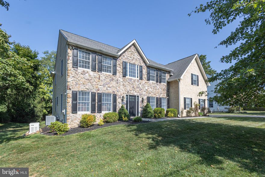 This home is a must see! A rare find in Yardley Boro with golf course views! Enjoy the best of both worlds—all the charm of small town living with all the amenities of a more modern home. A bluestone walkway leads to the entry of this stone front colonial featuring 9 foot ceilings and gleaming hardwood floors throughout the home. The two-story foyer is complimented by an elegantly hardwood turned staircase and leads to the gracious formal living and dining rooms. The spacious eat-in kitchen is ideal for entertaining with a striking contrasting center island with a new quartz countertop and stainless-steel appliances and opens to a sunny breakfast area with French doors leading out to a sprawling paver patio boasting multiple dining and entertaining areas overlooking a scenic wooded backdrop and steps down to the rear yard. The bright 2 story great room is the heart of the home, with lots of windows allowing an abundance of natural light and a beautiful stone gas fireplace ideal for those chilly autumn evenings. A convenient first floor bedroom and full bath allows guests to have a private retreat. Also found on this level is a spacious laundry/mud room and powder room. The second floor also boasts hardwood floors with 4 large bedrooms, including the primary suite with a private sitting area featuring a cozy gas fireplace, oversized walk-in closets, and a recently updated luxurious bath boasting dual marble vanities, a stylish freestanding tub and beautiful tiled shower. Also on this level are three spacious bedrooms which share a recently updated hall bath. An unfinished lower level offers unlimited possibilities and wonderful storage. Additional home amenities include updated baths, a spacious 2 car side entry garage outfitted with epoxy floors, New HVAC, whole house generator and neutral pallet throughout. Great location overlooking the Yardley Country Club and Golf Course with pond view, and short walk to downtown Yardley for shopping and dining. Commuting is a breeze too with the Yardley Train station just a short walk away. Don’t miss this amazing, Norman Rockwell-esque opportunity!