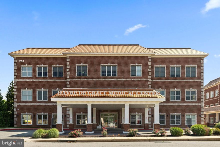 Professional Office Space Available in Havre de Grace Medical Center! Offered for sale: 4,338 square feet of medical office space located on the main level of Havre de Grace Medical Center. Public records identify the space as Unit 102, though it is physically labeled on-site as Units 103 and 104. The suite is currently configured as two separate spaces. One side is set up as a medical office, and the other is leased to a physical therapy provider with a 5 year lease in place at a fixed $24 per sq ft. Features include multiple private offices, reception areas, restrooms, kitchenettes, laundry areas, and open workspaces. The building offers level main entry, elevator access, and free surface parking.