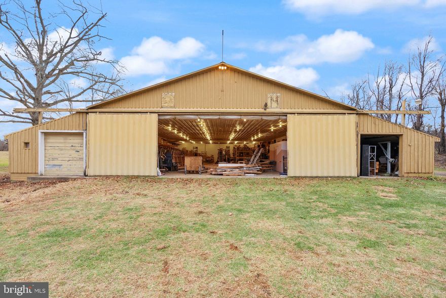 Three purchase options available: 
Option 1 includes the primary residence on 3.8 acres with an existing workout building offered at $1,000,000. 
Option 2 includes the home and a 9,200 sq. ft. building situated on 6.7 acres offered at $1,400,000. Option 3 includes the home, 9,200 sq. ft. building, and a fishing shack on an additional 0.75-acre parcel (7.45 acres total) offered at $1,600,000.

A rare opportunity to own a custom mid-century modern home on a private 6.7-acre setting in Warrenton, VA—complete with a 9,150 sq. ft. conditioned building and a recreational facility:  775 sq. ft. gym/pool house with a full bathroom. This architecturally unique home features vaulted wood-beamed ceilings, walls of glass, and open living spaces that blend beautifully with the natural surroundings. While the home would benefit from some updates, it offers tremendous potential in an exceptional location.
The main level includes a dramatic great room with panoramic views, a floor-to-ceiling brick fireplace, and access to an oversized deck perfect for entertaining or enjoying peaceful sunsets. The open kitchen features natural wood cabinetry and a center island, offering an excellent template for modern upgrades.
The walk-out lower level provides flexible space for recreation, home office use, or guest accommodations. Outside, the property features mature trees, a fenced yard, and an in-ground pool ready for restoration—ideal for creating your own outdoor oasis.

Included on the property is a county-approved 7,800 sq. ft. personal storage/workshop building with a 2nd-floor apartment (1 bedroom, full bath, full kitchen, washer/dryer) plus a 1,350 sq. ft. office/library with full bath and kitchenette. The apartment is approved as a second dwelling (ADU). 

Seller requires a 1-year leaseback for the storage/apartment building.
Please request surveys and building plans from your agent.
