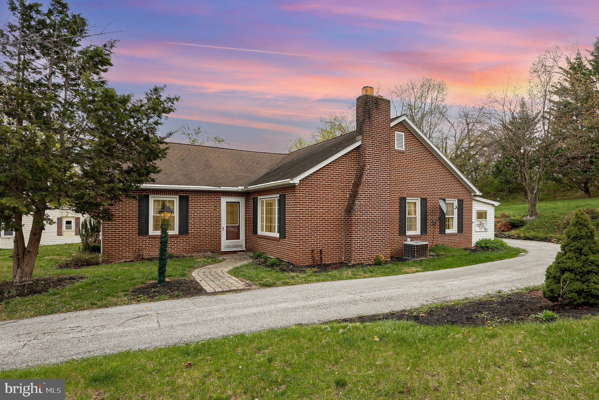 Welcome to this charming brick ranch nestled just on the outskirts of York Springs. This well-loved home is packed with cherished family memories and ready for its next chapter. Featuring three spacious bedrooms and two full baths, including a generously sized primary suite complete with a walk-in tiled shower, comfort and functionality await around every corner. The heart of the home is the spacious and welcoming kitchen, complemented by a designated dining area perfect for gathering with loved ones. A cozy brick fireplace anchors the main living room, while a separate family room provides additional space to relax or entertain. Enjoy the convenience of main-level laundry, thoughtfully located in the screened-in porch—ideal for enjoying quiet mornings or evening breezes. The full, unfinished basement offers endless possibilities and plenty of storage. Step outside to enjoy the expansive lot and oversized detached garage—perfect for hobbyists, extra vehicles, or additional storage. Quick access to Rt 15 and Rt 94 Makes your commute simple and quick.
