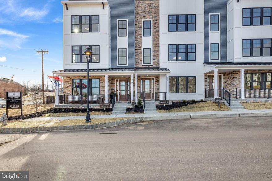 Step into the embrace of this enchanting 3-bedroom, 3.5-bathroom end unit townhome, complete with a convenient 4-stop elevator, poised for completion and eagerly awaiting your arrival in first quarter of 2025. This year, treat yourself to an extraordinary gift – a pristine, low-maintenance haven bathed in natural light.

Nestled within the vibrant community of The Towns at Newtown Walk, this end unit home gleams like a precious gem, boasting an exceptional floor plan adored by our residents. Upon entry into the foyer on the first level, you'll be enveloped in the space's radiant charm. Designed for your convenience, this level features a handy coat closet, a flexible guest bedroom or office space, and a full bathroom. The rear 2-car garage and spacious 2-car driveway offer ample parking and convenient access.

Ascending to the primary living level, prepare to be enchanted by the natural light cascading through numerous windows, accentuating the already lofty 10-foot ceilings and the expansive layout. The kitchen, aglow with sunlight, commands attention with its 42" soft-close cabinets, gleaming quartz countertops, a magnificent island, stainless steel appliances, and dazzling hardwood floors. Hosting guests becomes a delight in the luminous dining area, while relaxation beckons in the spacious living area, complete with a cozy gas fireplace.

The sun-drenched primary bedroom easily accommodates a king-sized bed, dresser, and nightstands, with generous space in the expansive walk-in closet for your wardrobe and shoe collection. Unwind in the ensuite bathroom, where natural light dances upon the walk-in shower with a bench, the private water closet, and the double vanity.

A hallway with laundry facilities leads to a second large bedroom with an ensuite bath. However, the true treasure of this remarkable home awaits – the rooftop terrace, surrounded by windows that bathe the space in radiant light. Imagine savoring your morning coffee as the sun rises or enjoying al fresco dinners with loved ones. This space even allows for planter gardening and the potential for a fireplace or BBQ area.

Being an end unit, this townhome is adorned with extra windows, ensuring an abundance of natural light from every angle. The Towns at Newtown Walk offers a final opportunity to join the thriving Ellis Preserve community. With easy access to major roadways, the airport, the train station, and Routes 252 and 3, your daily commute is effortless.

Please note that actual home finishes may vary, as this home is currently under construction. Don't miss the chance to claim this exceptional, well-lit, and contemporary 3-bedroom, 3.5-bathroom townhome as your new sanctuary!