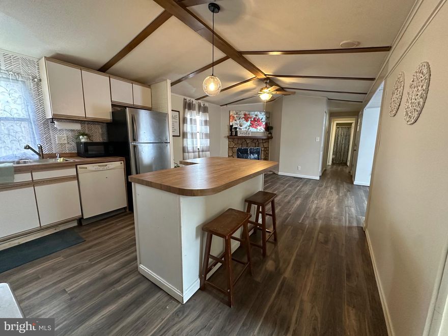 Owner says bring a reasonable offer! Welcome home to this spacious 4-bedroom, 2-bath mobile home set on a pleasant, tree-lined street. A welcoming covered porch leads you inside to a comfortable living room complete with a cozy fireplace—perfect for relaxing evenings. The kitchen is open to the living space for being together, and has been update, with an almost new refrigerator. The separate dining room offers plenty of space for gatherings, while the well-designed layout places the primary bedroom at one end for added privacy. The primary suite includes its own full bathroom with jacuzzi tub and 2 walk in closets, with three additional bedrooms and a second full bath providing room for everyone. All bedrooms have brand new carpet. Outside are 2 covered porch areas and 2 large sheds for storage. With its generous layout, inviting features, and great location, this home is ready for its next owner to bring fresh ideas and make it their own. 
Owner is motivated and will consider all reasonable offers. 
With ownership in Williams Estates, park approval is required. Lot rent for this property is $1007 per month, which includes taxes and water.  You can purchase this home with cash or obtain financing from the following, or any other financial institution lending on mobile homes: Park Lane Financing Solutions, APGFCU, Hartford Bank, Mainland Financial or 21st Mortgage.  Welcome home to 3532 Wagon Train Road!