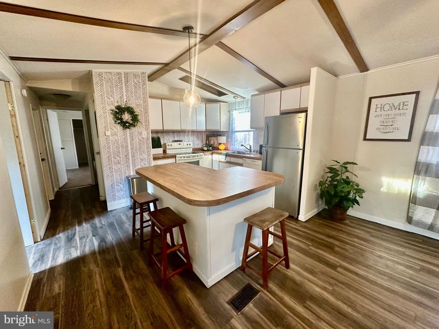 Owner says bring a reasonable offer! Welcome home to this spacious 4-bedroom, 2-bath mobile home set on a pleasant, tree-lined street. A welcoming covered porch leads you inside to a comfortable living room complete with a cozy fireplace—perfect for relaxing evenings. The kitchen is open to the living space for being together, and has been update, with an almost new refrigerator. The separate dining room offers plenty of space for gatherings, while the well-designed layout places the primary bedroom at one end for added privacy. The primary suite includes its own full bathroom with jacuzzi tub and 2 walk in closets, with three additional bedrooms and a second full bath providing room for everyone. All bedrooms have brand new carpet. Outside are 2 covered porch areas and 2 large sheds for storage. With its generous layout, inviting features, and great location, this home is ready for its next owner to bring fresh ideas and make it their own. 
With ownership in Williams Estates, park approval is required. Lot rent for this property is $1133 per month, which includes tot lot, community center and water.   Welcome home to 3532 Wagon Train Road!