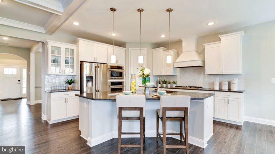 APRIL 2023 DELIVERY!!! Beechfield Manors is the ONLY New Active Adult 55+ Community in Prince George's, MD. A planned community with a clubhouse, fitness center, firepit, swimming pool & walking trail. This two-story home with basement 3,551 sq. ft. home is designed for comfortable living. The covered front door leads to a foyer, a secondary bedroom with full bathroom, In the back of the home an open main living area with separate formal dining room, Kitchen w/Island, pantry granite countertops & stainless appliance, Great Room with gas fireplace, kitchen breakfast nook that leads to the covered deck for outdoor living . The owner's suite is in the back of the home and includes an en-suite, and walk-in closet. Upstairs is a lovely loft and 3rd bedroom with full bathroom, this home has a two-car garage, the basement has an areaway, finished recreation room and full bathroom. Plenty of space for everyone! Photos are for illustrative purposes only NOT OF ACTUAL HOME. Seller closing assistance is available when using in-house lender Lennar Mortgage & Lennar Title Company