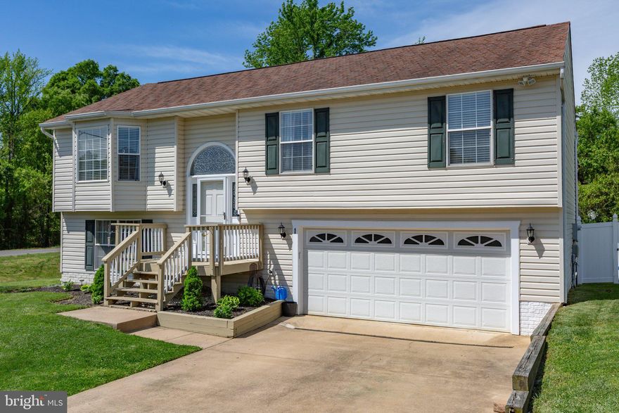 Located in the heart of South Stafford, just minutes from Route 1, Interstate 95, and the Leeland station VRE/Commuter Lot. Beautiful open split foyer features a spacious living room with crown moulding, chair rail, beautiful hardwood floors, lots of windows, and a vaulted ceiling. The kitchen offers newer French doors leading to the deck, stainless appliances. The lower level boasts a large rec room and leads to the fully private vinyl-fenced backyard, which is spacious with a fire pit, oversized garage with opener. There have been a lot of updates in the past few years. Water heater (2022), HVAC (2018), new paint, ceiling fans, updated bathrooms, chandeliers, appliances, and flooring.  There can be a fourth bedroom option downstairs.