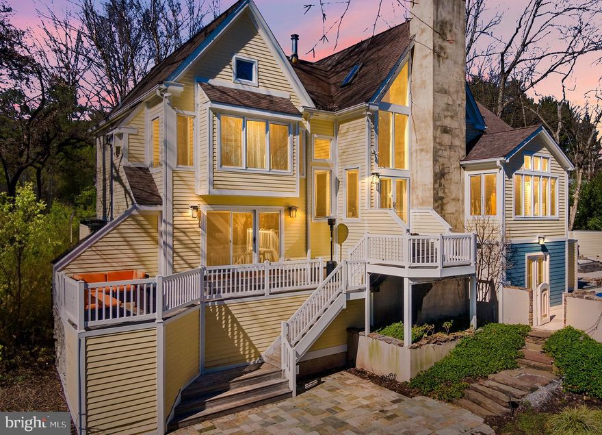 Welcome to 511 W Prospect Avenue, offering an unparalleled living experience perched upon 2.7 sprawling acres of picturesque landscape. Enjoy unmatched outdoor areas overlooking the property’s meandering stream and pond which gracefully abuts the vast 279-acre Gwynedd Nature Preserve and the 16-mile Green Ribbon Trail. An architectural masterpiece, this residence harmonizes with its surroundings. Inside, discover an open-concept main level with a centralized Great Room as the heart of the home, where soaring ceilings and walls of windows seamlessly blend with a grand floor-to-ceiling two-sided fireplace. Illuminated by all-new lighting, the main floor showcases refinished floors and radiant-heated tile floors. The Chef's kitchen is a culinary masterpiece boasting a Viking Range/oven, Wolf wall oven, Wolf microwave, three sinks, granite countertops, cherry cabinets, and a large center island with a breakfast bar. The adjacent dining area, sharing one side of the fireplace with the Great Room, unveils breathtaking views of mature trees and a gently babbling stream. The lower-level den and office is complete with built-in cherry bookcases, a gas fireplace, and an entertainment center. A Sonos sound system follows throughout the den, kitchen, and Great Room, creating the perfect ambiance for gatherings. As you ascend to the upper level, a luxurious Owner's Suite awaits, adorned with a cathedral ceiling, gas fireplace, and chandelier. Dual walk-in closets and a spa-like ensuite bathroom, boasting radiant heated flooring and a glass tile shower with a seat and double shower heads, elevate the concept of luxury living. On the opposite wing of the home, a separate upper level area houses two additional bedrooms and a shared hall bathroom. The private, outdoor oasis mirrors the interior's splendor, featuring a Brazilian hardwood deck, two patios, a sparkling in-ground pool, and a hot tub—all overlooking the serene panorama of the stream and adjoining nature preserve. Completing the allure of this residence is an oversized attached two-car garage with a bonus finished space above. Immerse yourself in the epitome of refined living, where nature and sophistication converge in perfect harmony.