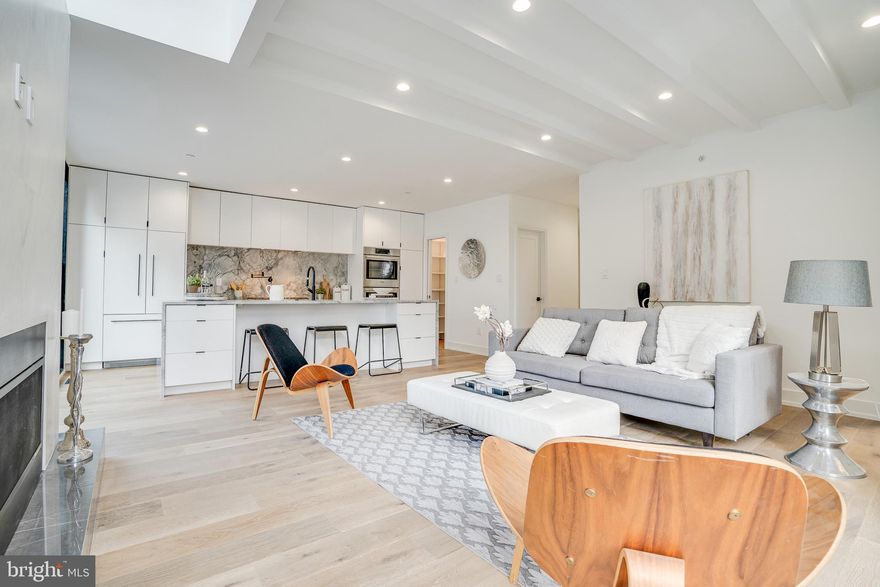 Luxury has a new home and it can be found at 726 S Hicks Street! This new construction  is designed to accommodate the highest standard of living this city has to offer. Luxuriously appointed by one of the most acclaimed architects, this custom home covers over 3,895 square feet of the most sought-after amenities a residence can have. This estate is pin pointed in the center of Graduate Hospital on a lovely tree-lined corner with an assortment of nearby greenery. The exterior boasts a brick facade with fiber cement siding, corrugated metal and over-sized aluminum windows. This home comes well equipped and ready for 2021 with its own home automation system. Step into the living room with a heightened ceiling and exposed beams accompanied by a cozy gas fireplace. White Oak Herringbone wood flooring and stair treads have been hand selected and laid down throughout the property. That out-of-the-magazine kitchen you desire has come to life! Enter a refined space with such gourmet amenities as stone countertops and island, a pristine backsplash, and a sleek set of finely crafted custom cabinets. A large walk-out balcony with floor to ceiling glass window tops off this main floor. Breathtaking views will delight him and her from every angle throughout this home. Continue to explore the rest of the home to find five generously sized bedroom and den spaces and a captivating master suite with large walk-in closet and spa bathroom with top-notch upgrades such as toilet enclosures, full glass shower stall, and a custom double vanity. In total, this home has five and a half bathrooms throughout, each boasting similar modern amenities shown throughout. Your days of taking the stairs has come to a fault as a private elevator has been installed to take you from level to level with no thought. The full finished basement will add another dimension of that feeling of home as it has a wet bar, a full bathroom, and an extensive amount of space to host and entertain!