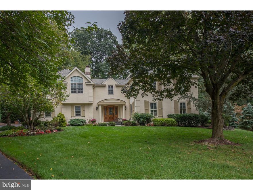 Spectacular Home nestled in a prime cul de sac location in Radnor. This French Colonial home sits beautifully on an almost acre lot. A lovely flagstone walkway lined with Belgian blocks leads to a covered entry way with flagstone steps and custom door. The front door opens into a lovely Foyer with 2 closets. There is a handsome paneled Library with hardwood floor, gas fireplace and built-in bookshelves with pocket doors opening into back Hallway. Along the Hallway is a Bedroom with 2 large closets and full Bath ( perfect as an "in law" or "au pair" Suite) The front Foyer leads to the Living Room, Dining Room, 1st floor stairs, Powder Room and an additional large closet. Gracious Living Room with wood burning fireplace and formal Dining Room with crown molding. Wonderful large Kitchen and Woodmode cabinets, double oven,Island with space for sitting,planning desk and huge Pantry. Kitchen dining space becomes the focal point for easy entertaining with beautiful built-in breakfront for display and storage. The Kitchen opens into a fabulous Family Room with wood beams and cathedral ceiling, handsome stone hearth with gas fireplace, custom built-in cabinetry, hardwood floor and Bose system with built-in speakers. French doors open to large flagstone Patio for great outdoor entertaining overlooking gorgeous large flat yard landscaped for privacy. The Kitchen also has access to Garage via back hallway. Butler's Pantry located along the Hallway with additional cabinets, sink, dishwasher and refrigerator. Stairs lead to the upper level to 2 Bedrooms, connected by a Jack and Jill Bathroom, 2 more Bedrooms, one used as an office, updated Hall Bath, Laundry Room with set tub, ironing board, cabinets above. Wonderful Master Bedroom Suite with private hallway with His and Her walk-in closets, one is cedar, plus linen closet. Fabulous Master Bath with walk-in shower with granite seat, dual shower heads, double vanity with granite counter and soaking tub.The Hallway leads into large Master Bedroom with cathedral ceiling and large Sitting area with beautiful views overlooking private backyard. The Basement is a great multi purpose room with new neutral carpet.This home offers other features such as 3 zoned gas heat and A/C & whole house gas Generator. This home has it all   quality construction, great space for today's living and easy access to train, schools, the town of Wayne & all major Highways plus the top rated Radnor Schools!!