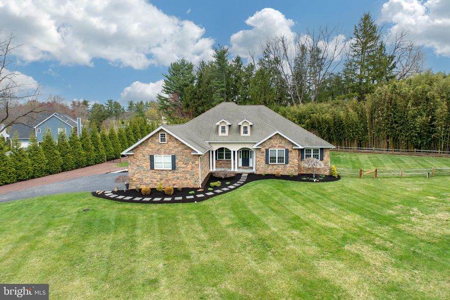 Welcome to this elegant ranch-style home, nestled on a beautifully landscaped private, flat acre+ lot in one of East Goshen’s most desirable locations. This exceptional residence blends timeless charm with modern luxury, offering a bright, open floor plan ideal for both relaxed living and stylish entertaining.
Step through the front door and you’re immediately welcomed by gleaming hardwood floors, detailed moldings, and a sunlit, inviting interior. At the heart of the home is a gourmet kitchen, thoughtfully designed for everyday living and entertaining alike. It seamlessly opens to a spacious great room, anchored by a gas fireplace and French doors that lead to a tranquil outdoor patio, ideal for indoor-outdoor gatherings.
A formal dining room, is gracefully set off of the great room, adds a touch of sophistication and opens to the entry foyer. The luxurious first-floor spacious primary suite offers a private sitting area, French doors to the patio, and ensuite bath featuring a large walk-in shower, Jacuzzi tub, and a dual vanity. 
Two additional, generously sized bedrooms share a full hall bath.  The laundry room is conveniently located on the first floor enhancing everyday functionality. In addition to a well designed first floor - the custom-finished basement adds incredible versatility and space - delivering the fourth bedroom with a full bathroom, bar area, home gym, and additional recreation space—perfect for additional living space, entertaining, or a private in-law suite. This rare offering on a peaceful setting is completed by an oversized 3-car garage, fenced in backyard and is conveniently located to Paoli Pike, Route 202, Downtown West Chester and East Goshen Park! Showings will begin on Friday 4/11.
