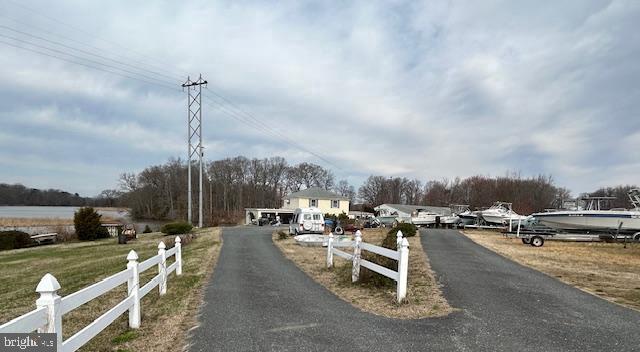 8 acre parcel on the west side of Rt 50 with water front pier and private landing. Over 9000 sq feet of structures including a residence on the 3rd floor. Nicely elevated with great views down Skipton Creek the property is zoned LC and offers a multitude of applications. Currently a marine business that is also available. Only 5 miles from Easton the property offers a great location for a business that services Talbot, Caroline, and Queen Anne and needs Rt 50 access and visibility. Please give prior notice to access the property. Agent will provide access on weekends. See Talbot zoning documents for a list of acceptable uses. Must provide 3 months for possession. Property will be delivered in broom swept condition with all business property removed. First time available since 1960. Being sold "as is" relating to all structures.
Some applications include: nursery, agriculture applications, aquaculture, educational facility, nursing care, roadside vendor, office and recreational application, warehouse or storage, boat or auto sales, and a multitude of additional uses are permitted. Preliminary survey available.
Lane Engineering is familiar with the property for addition uses.