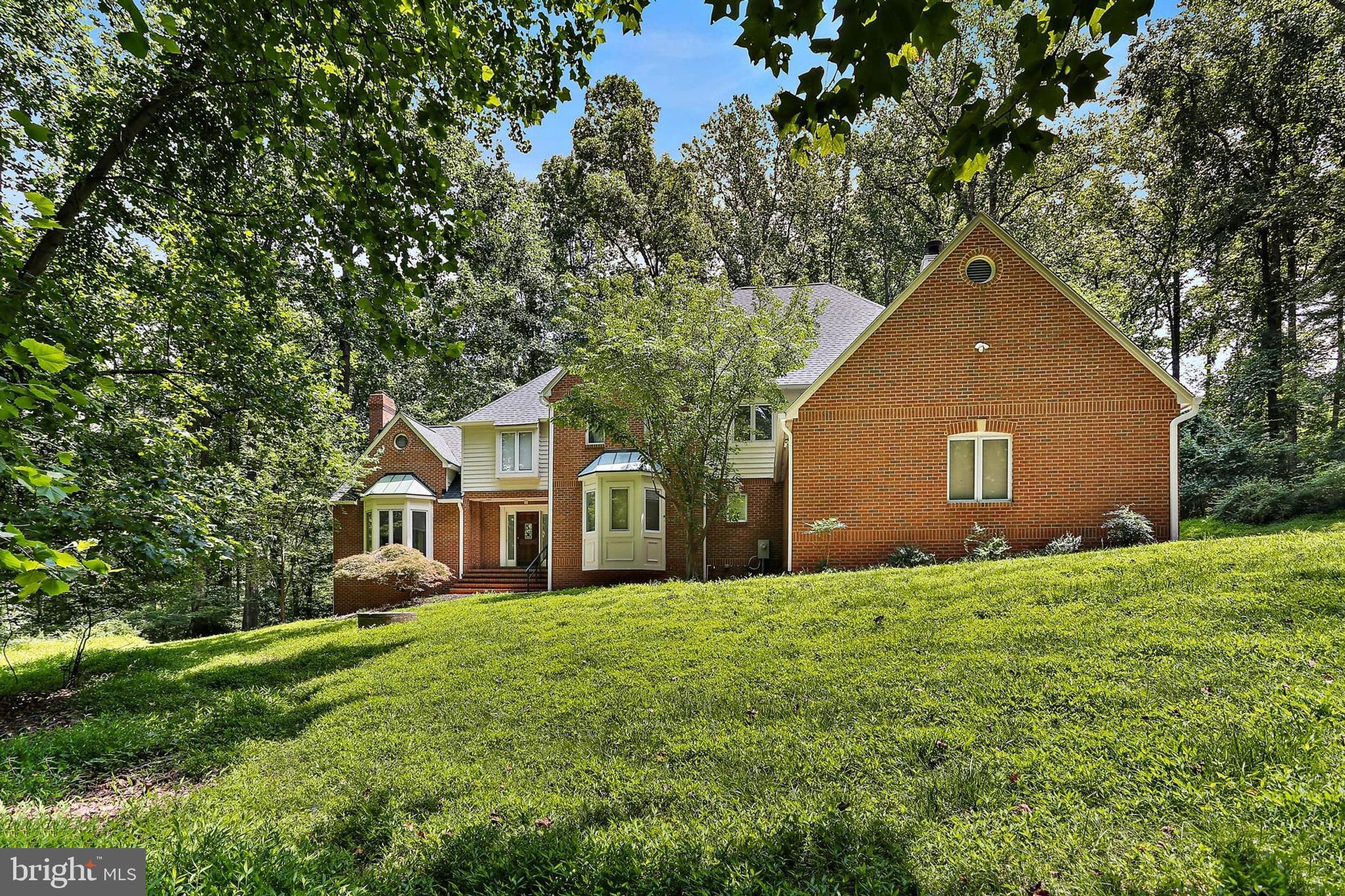 Welcome to your dream home! This gorgeous home offers serene woodland views, open-concept living, and elegant details throughout—gleaming hardwood floors, soaring ceilings, and three wood-burning fireplaces. A spacious main-level room with bay windows and French doors is perfect for a home office or guest suite. The gourmet kitchen features white cabinetry, stainless steel appliances, a center island with cooktop, and peaceful views—ideal for entertaining or quiet mornings.
Enjoy 5 bedrooms, 5.5 baths, and recent upgrades including a new roof with new gutter and gutter guards (2022), water Heater (2024), deck (2025), Two New HAVC systems (2025), Basement new Floor (2025), New Oven (2025), Pella Window (2021), fresh paint and more. Bedroom Carpets will be replaced when a contract is ratified. (Old carpets are for showings only.)
Nestled in a quiet, well-maintained community with top-rated Howard County schools, this home is a rare gem. Don’t miss your chance to own a slice of modern luxury!