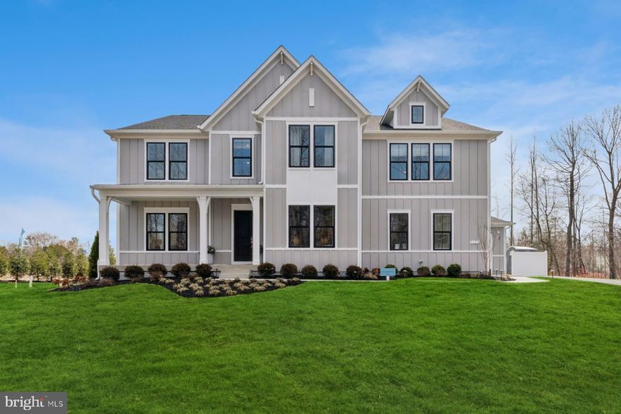 QUICK MOVE IN: APRIL DELIVERY
Stunning new construction Richmond model by K. Hovnanian on 10 private acres in Nokesville. This modern farmhouse-style home features a dramatic two-story great room, 10-foot ceilings, and a gas fireplace with shiplap and granite surround. The designer kitchen offers an oversized 13’ island, quartz countertops, light-toned cabinetry, and Monogram appliances including a 36” gas range, wall oven, and counter-depth refrigerator. Main level includes a private office, formal dining room, and bedroom with en-suite bath. Upstairs, the primary suite features a sitting area, dual walk-in closets, and a spa bath with freestanding tub and oversized shower. An expansive loft and additional bedrooms complete the upper level. Finished basement with full bath and expansive rec room provides added living space. Covered composite deck and 3-car garage.

Located within an exclusive 22 homesite semi-equestrian/estate community, ideal for those seeking space, privacy, and a true estate lifestyle. Enjoy easy access to shopping, dining, and key commuter routes including Route 234, Route 28, and I-66. Visit the model home at Occoquan Overlook, 9163 Peniwill Drive, Lorton, VA, open Saturdays and Sundays from 12–4 PM.

RENDERINGS/PHOTOS ARE REPRESENTATIVE ONLY AND MAY SHOW OPTIONS OR DECORATOR ENHANCEMENTS